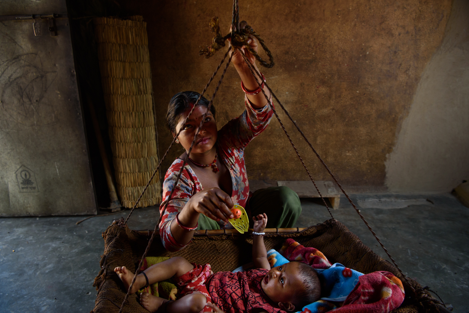  Sarita Majhi (17) with her five months old daughter Sumita at her home in Malpur Village, Chitwan, Nepal. Sarita says she was not interested in studies and left education after class 7. She eloped and married Shiva (20) who works as a labourer in De