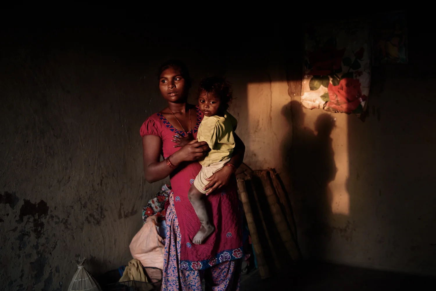 Anjana Majhi (17) and daughter Ishita (1). Anjana was pressured to marry by her aunt and uncle because of rumors about her alleged relationship with a boy. Anjana was sent to Pokhara when she was 7 years old to work as a maid in a house to support her family.