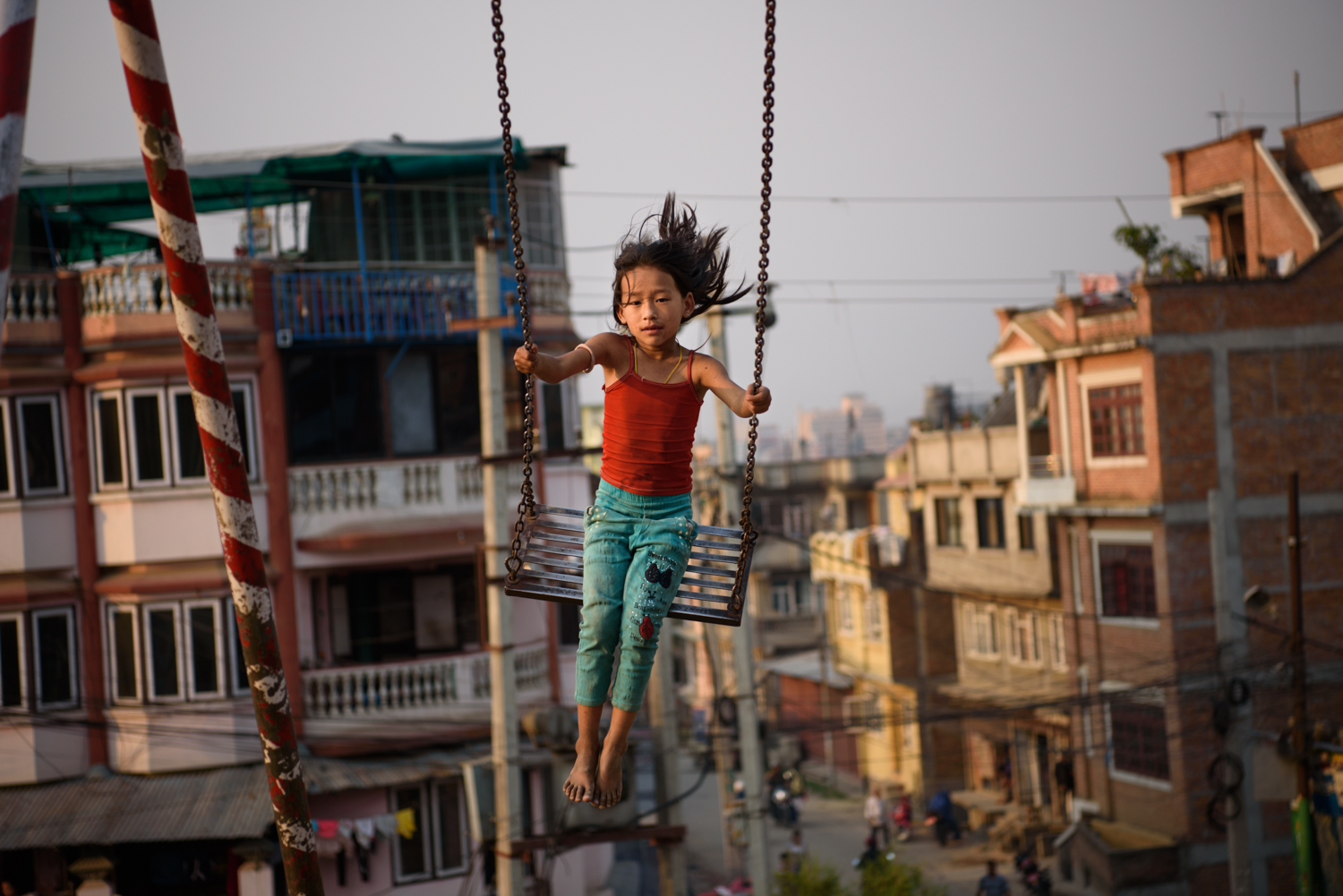  A girl plays at a public park in Patan city, Nepal. 