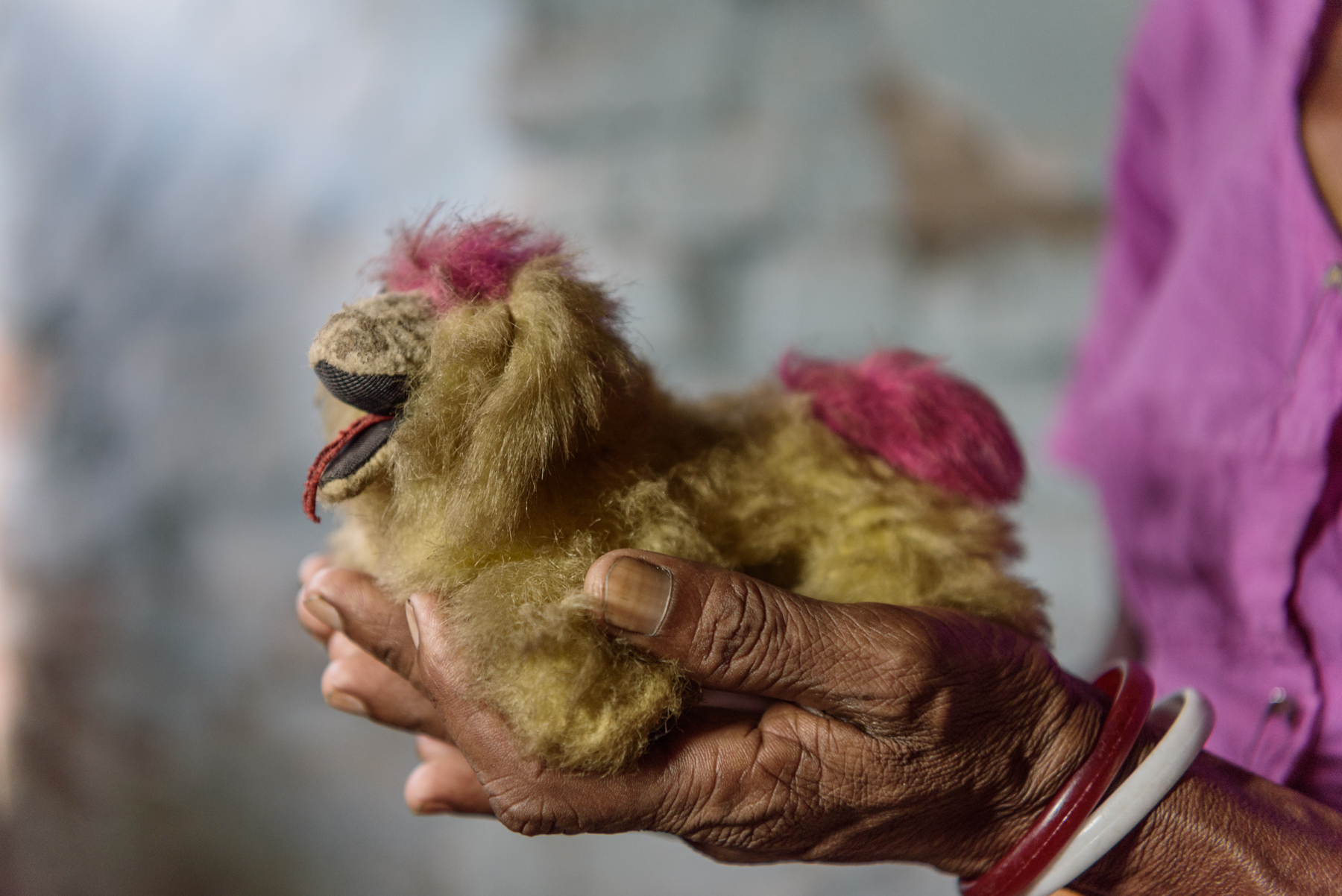  Sanchariya Oraon, 42, holds a toy belonging to her daughter Asha. Asha, 16, has been missing since six years. An acquaintance took Asha to the neighbouring state of Sikkim, India to work as a maid at a tourist lodge. Asha never returned home and the