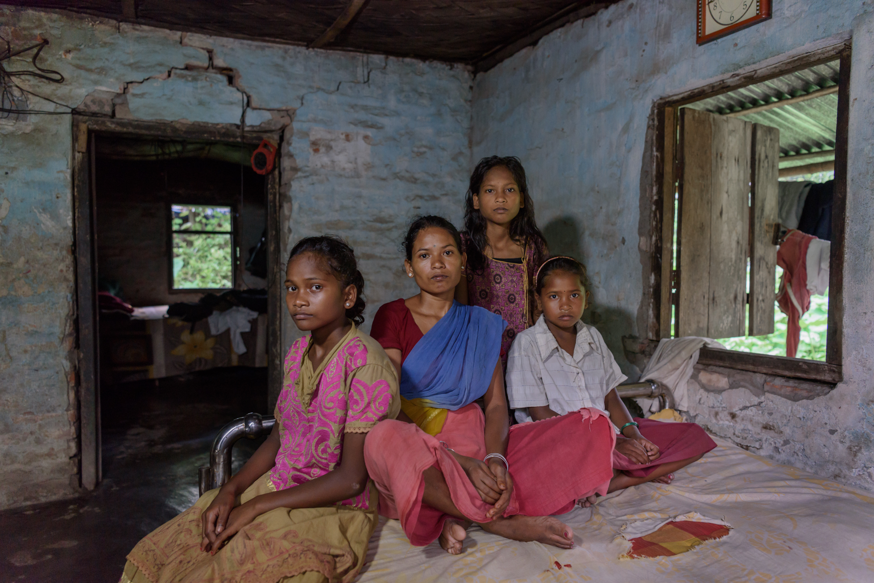 Champa Soren, 35, with her daughters Renuka, 15, Sonika, 16 and Roshni, 10. Champa used to be severely beaten by her abusive husband. To escape that, Champa fell into the hands of a trafficker who promised her a job and took her to Delhi and sold her for $300 in 2014. Champa was rescued from a private residence in Sonipat in July 2017.