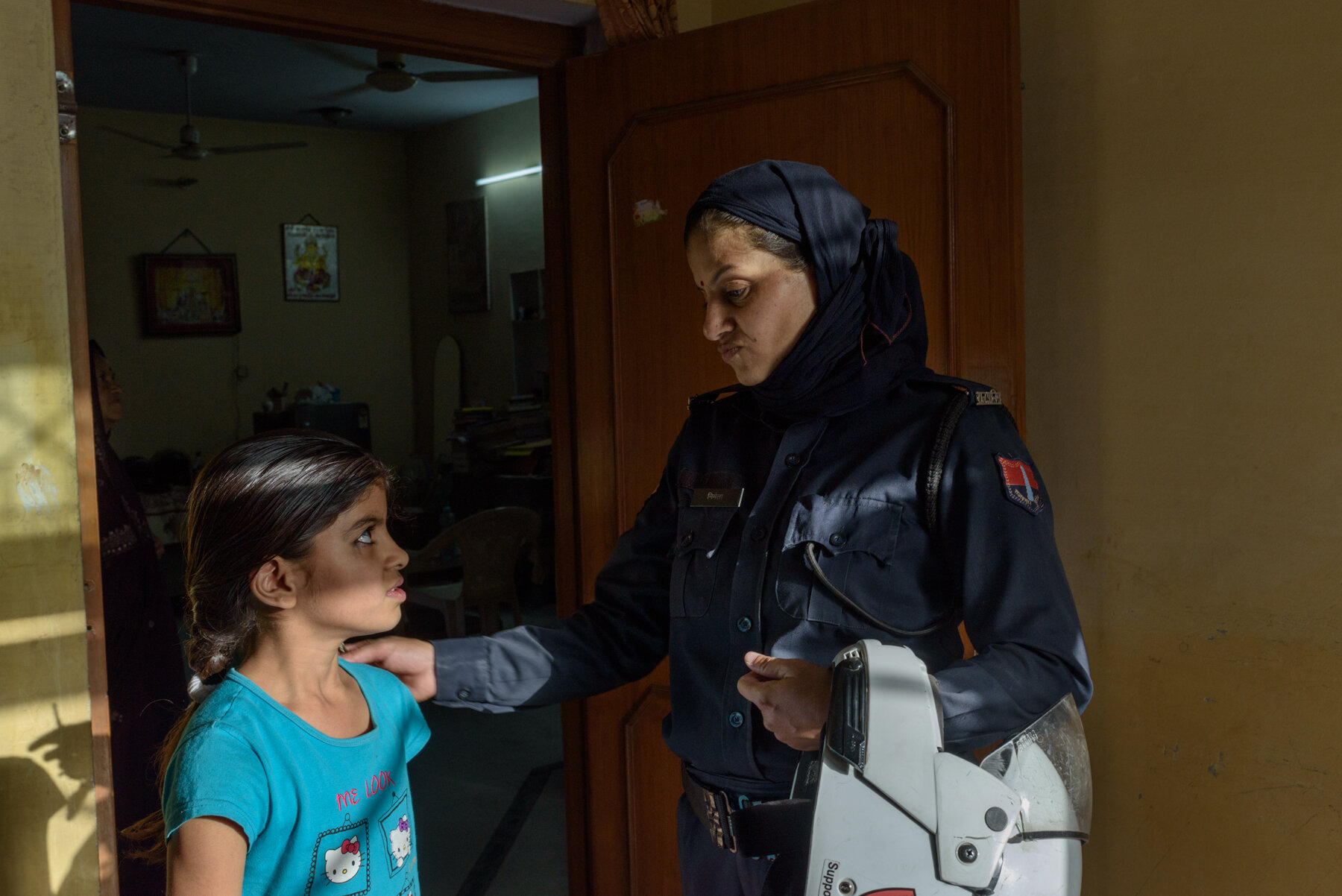  Nirmala Lakhera, 42,  with her daughter Krishna, 9, at home before leaving for duty on 21st April, 2018. 