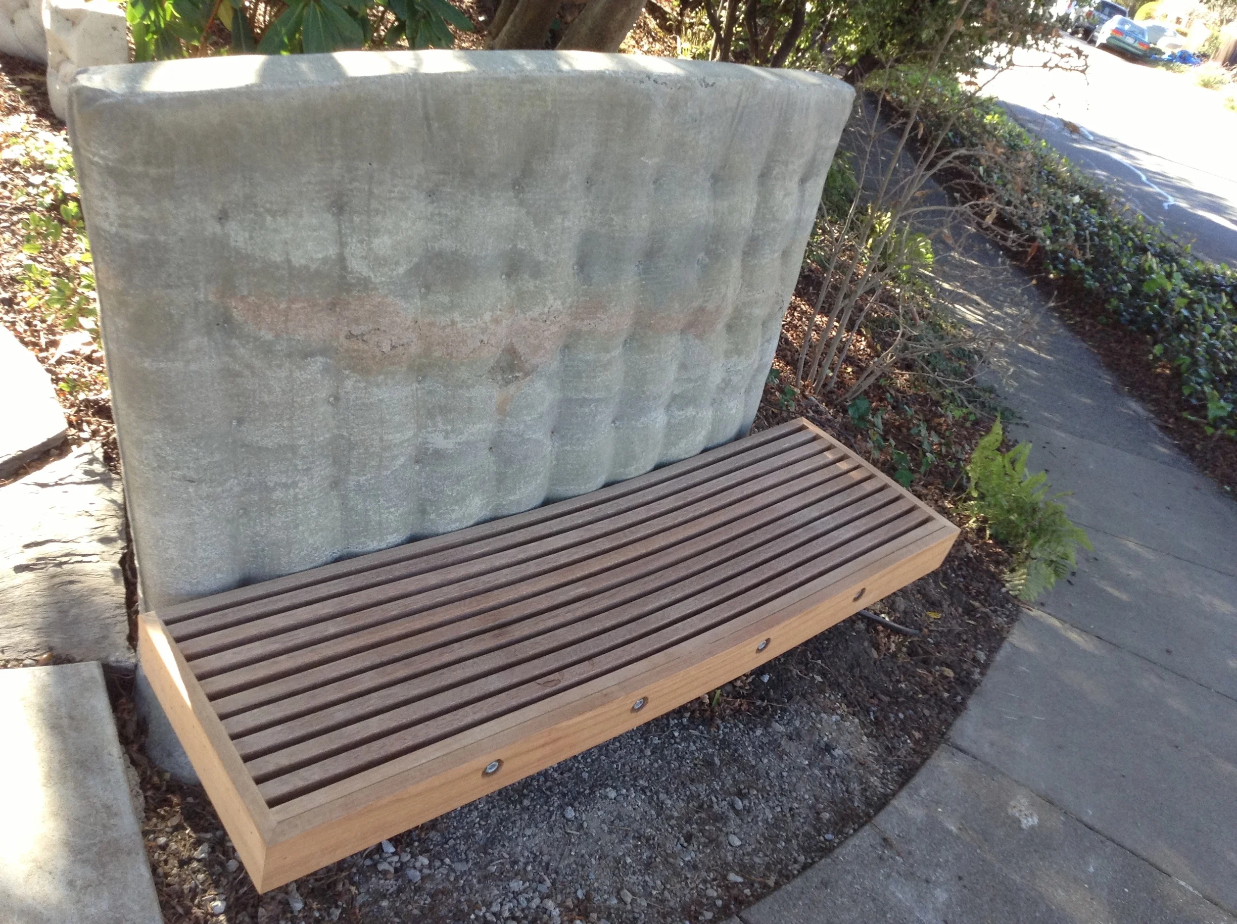  Appearing from a far like a mattress with a bench attached, this soft concrete form is surprisingly comfortable and the bench seat durable and weather resistant. 