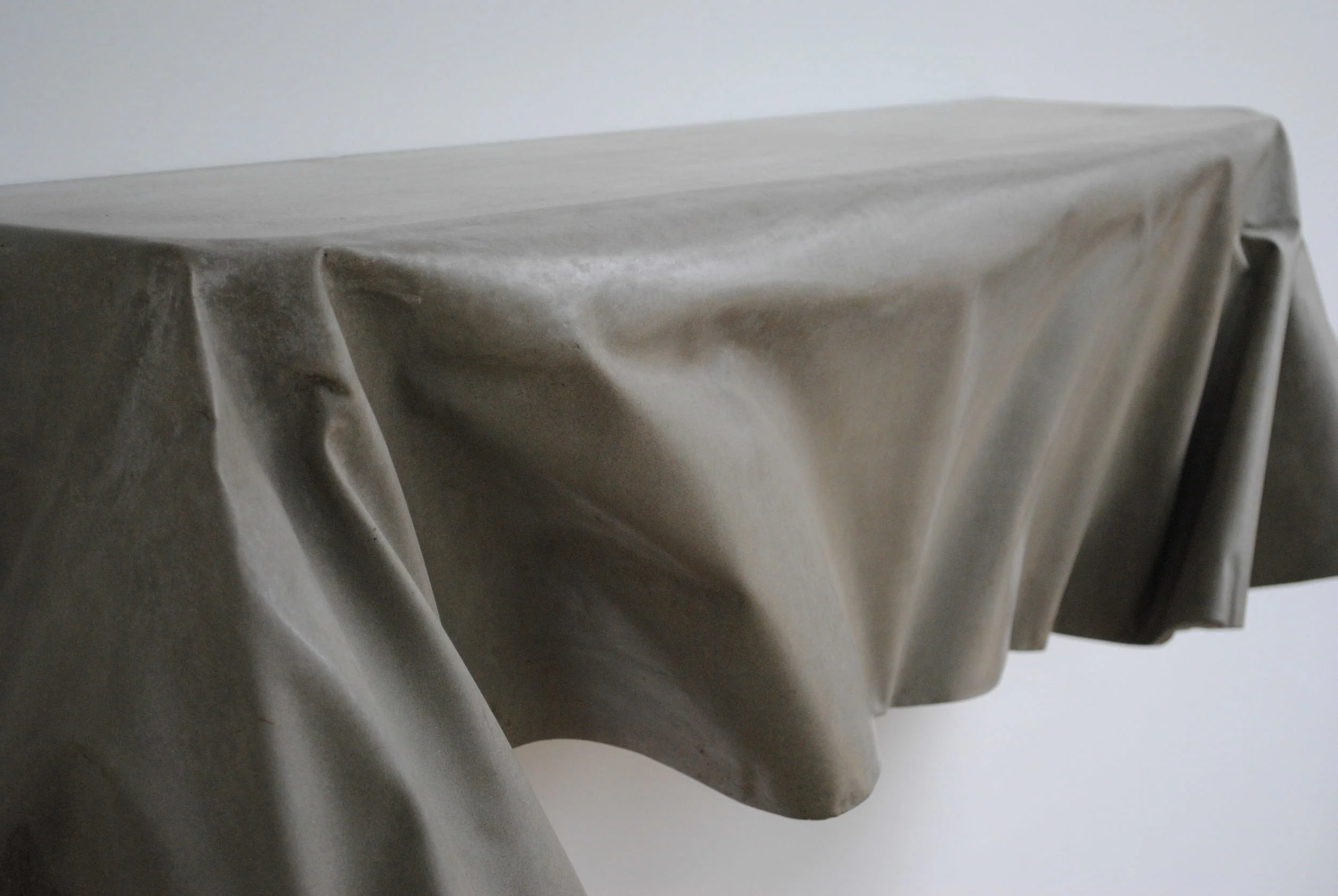  Draped shelf in natural color.&nbsp;Although the form is the same as other Draped shelves, each casting takes on it's own unique shape. 