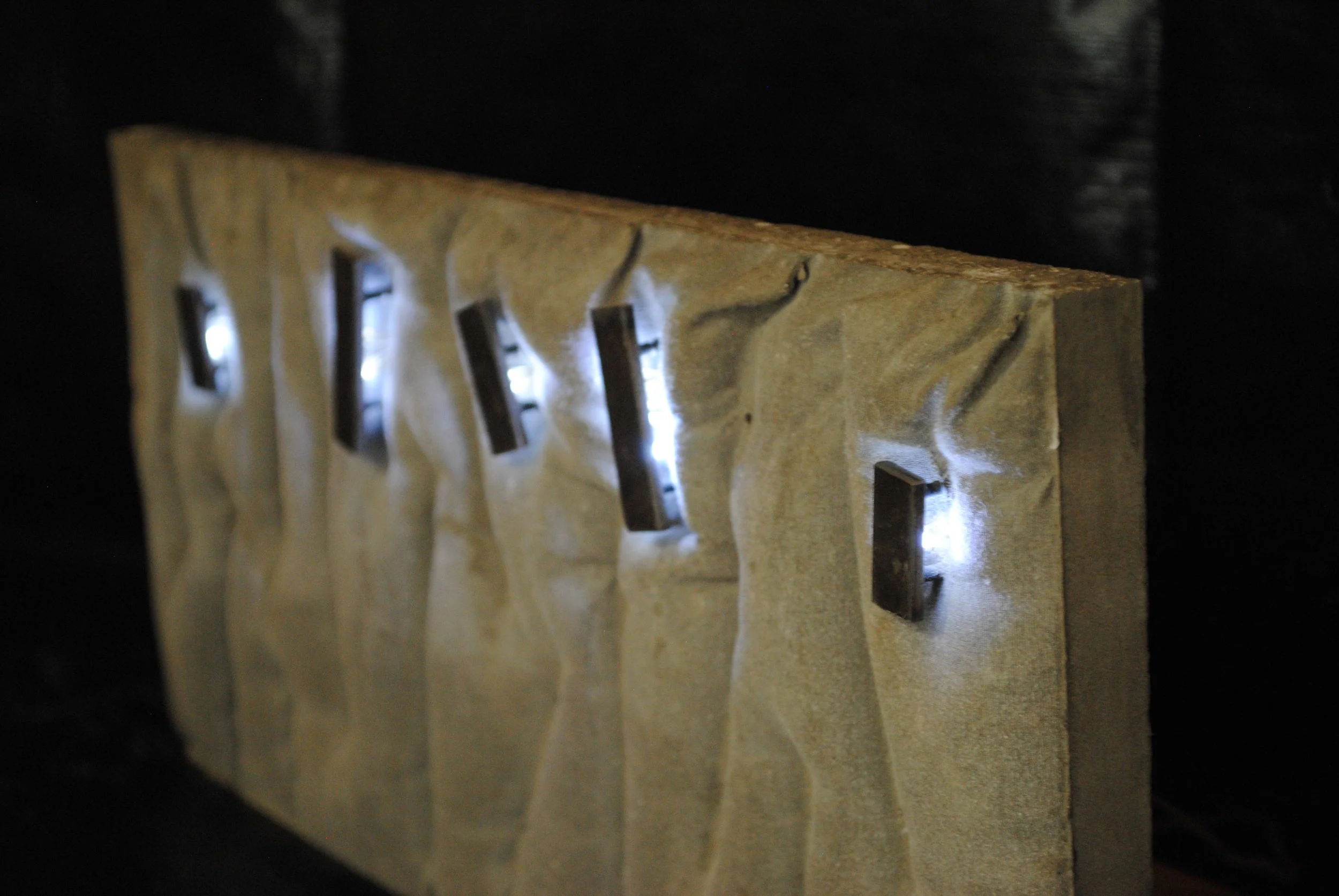  Concept for a retaining wall with integral lighting. Using steel plates and LED tape lights, this wall has energy and motion far beyond its geotechnical&nbsp;duties. 