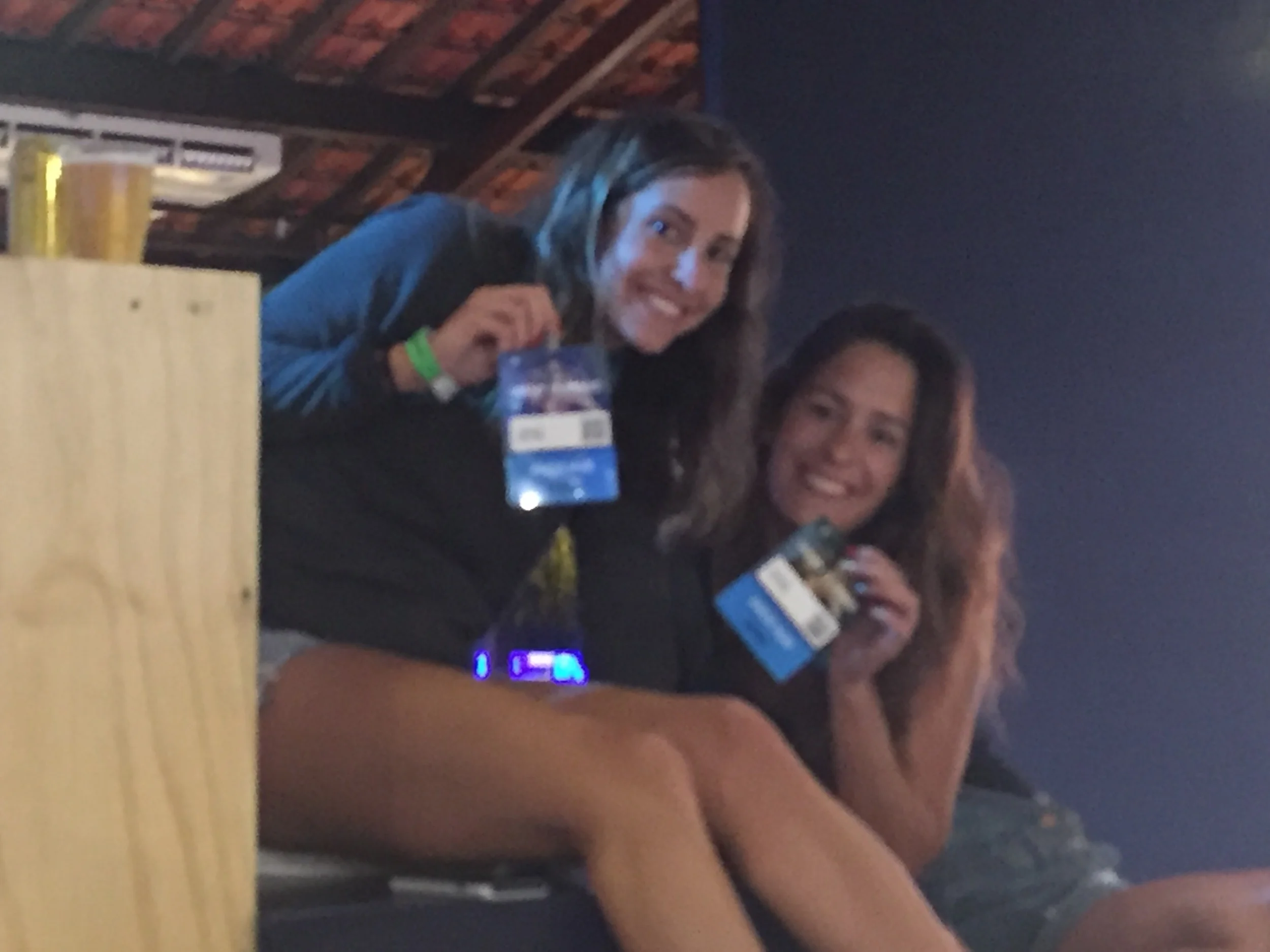 Lindsay and Hannah showing off their VIP credentials