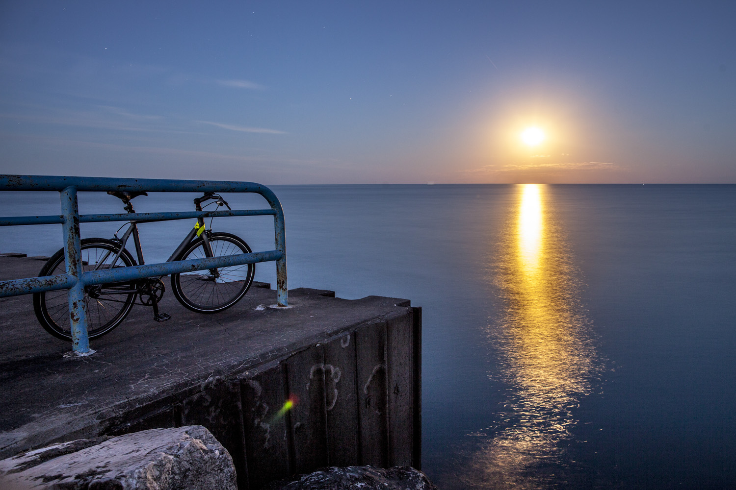 Full Moon Rise over Lake Michigan. Milwaukee Breakwater, WI.