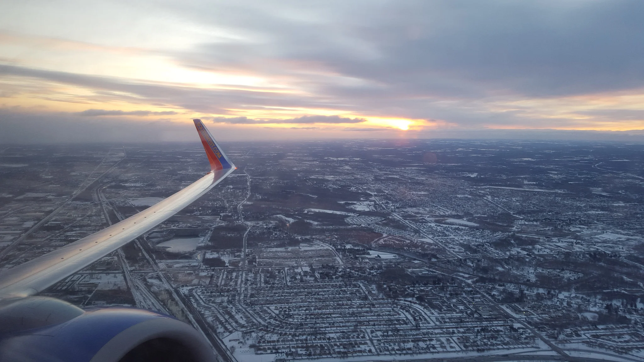 Flying out of Buffalo at sunrise. See you in a week, snow!
