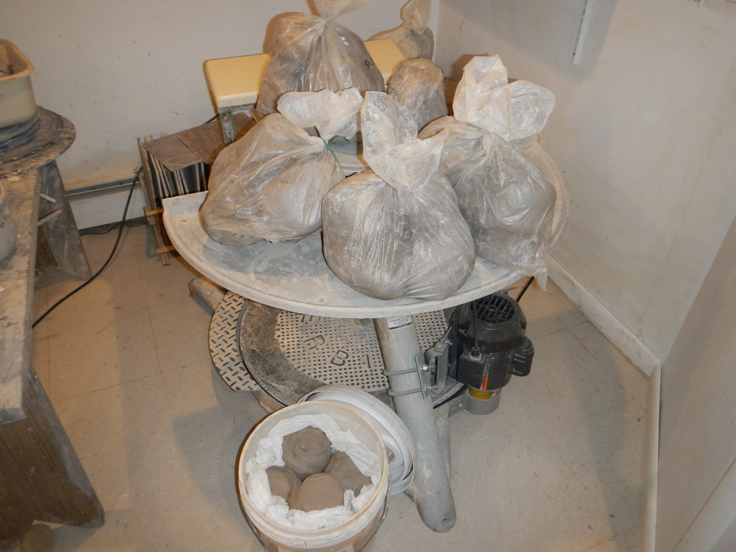 3 1/2 hours of reclaiming and wedging. This is what 130 lbs. of recycled and wedged clay looks like. 