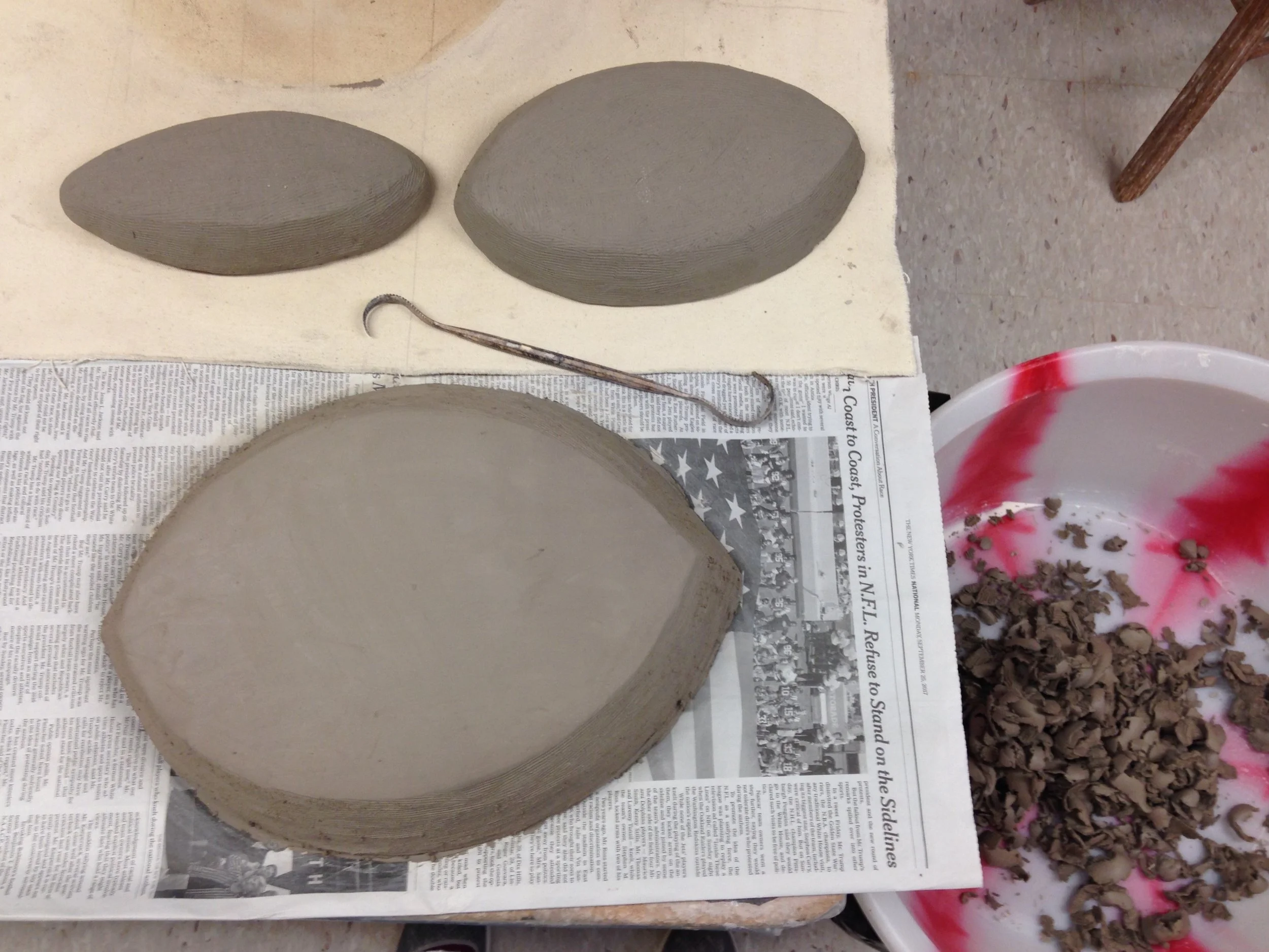 Initial solid humps of clay, basically patted into shape and groomed around the edges.
