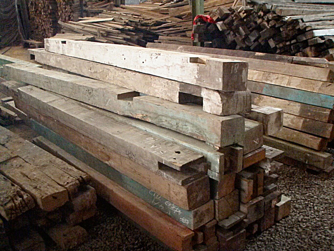  Teak and Rosewood beams and RR ties stored at a secret warehouse in the jungles of Southeast Asia 