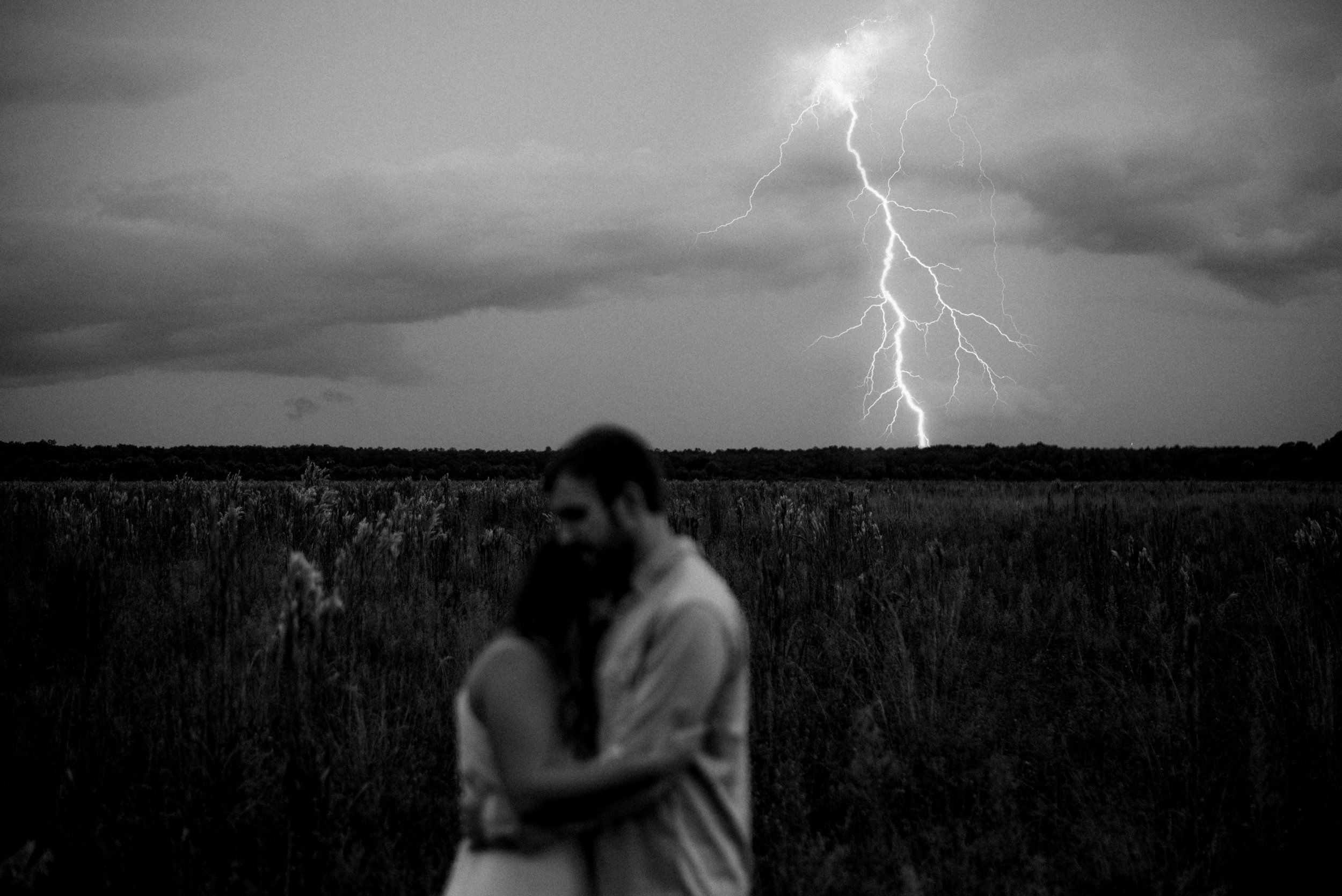  Jaeden & Mackenzie Hamernik Couple Portrait Session in an open field in Naples Florida during the stormy season. This moment embodies to keep faith that everything will be okay  