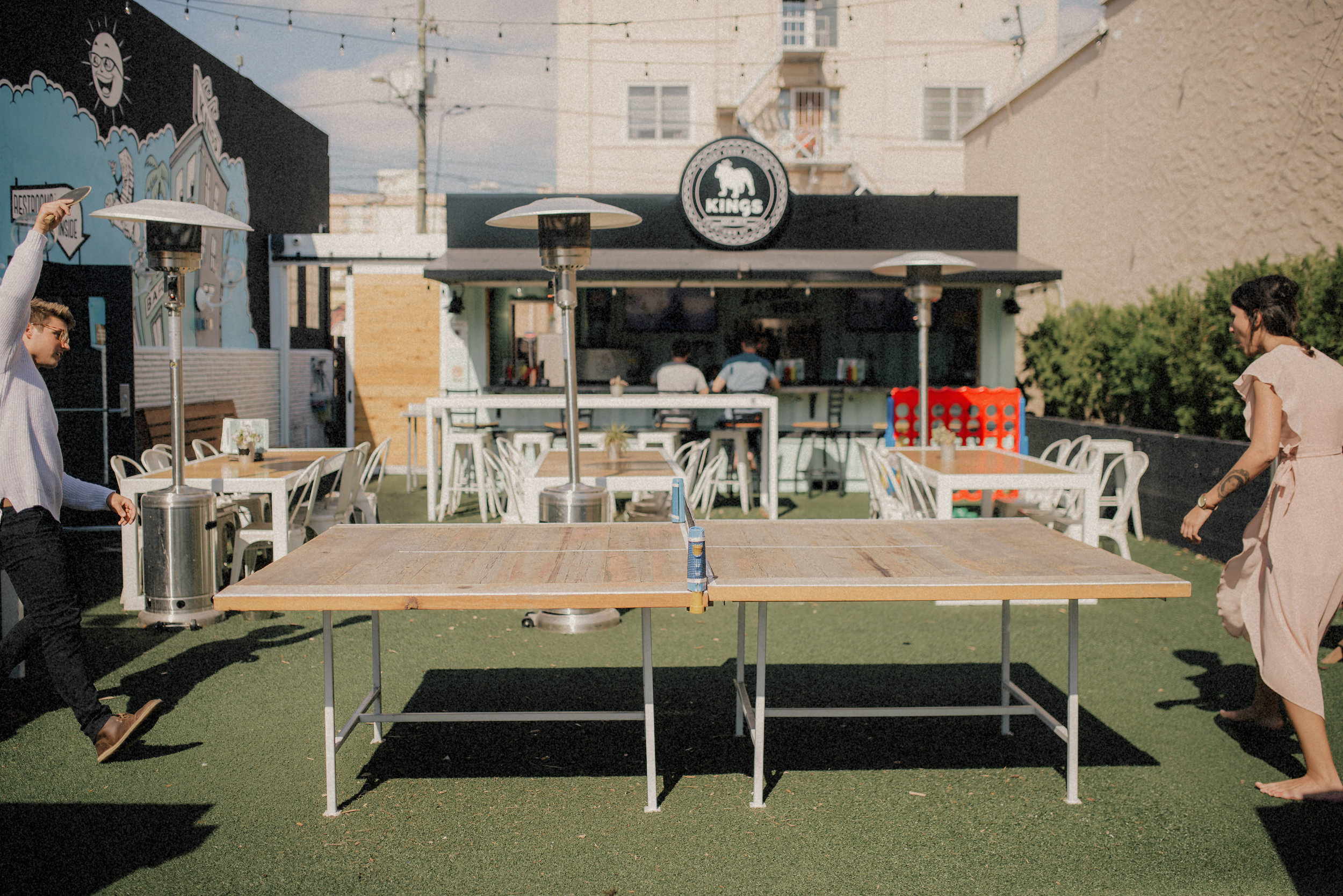  Hillary and Brandon at Kings Street Food playing Ping pong St Pete - couple portraits - st pete florida - naples florida wedding photographer - tampa wedding photographer 