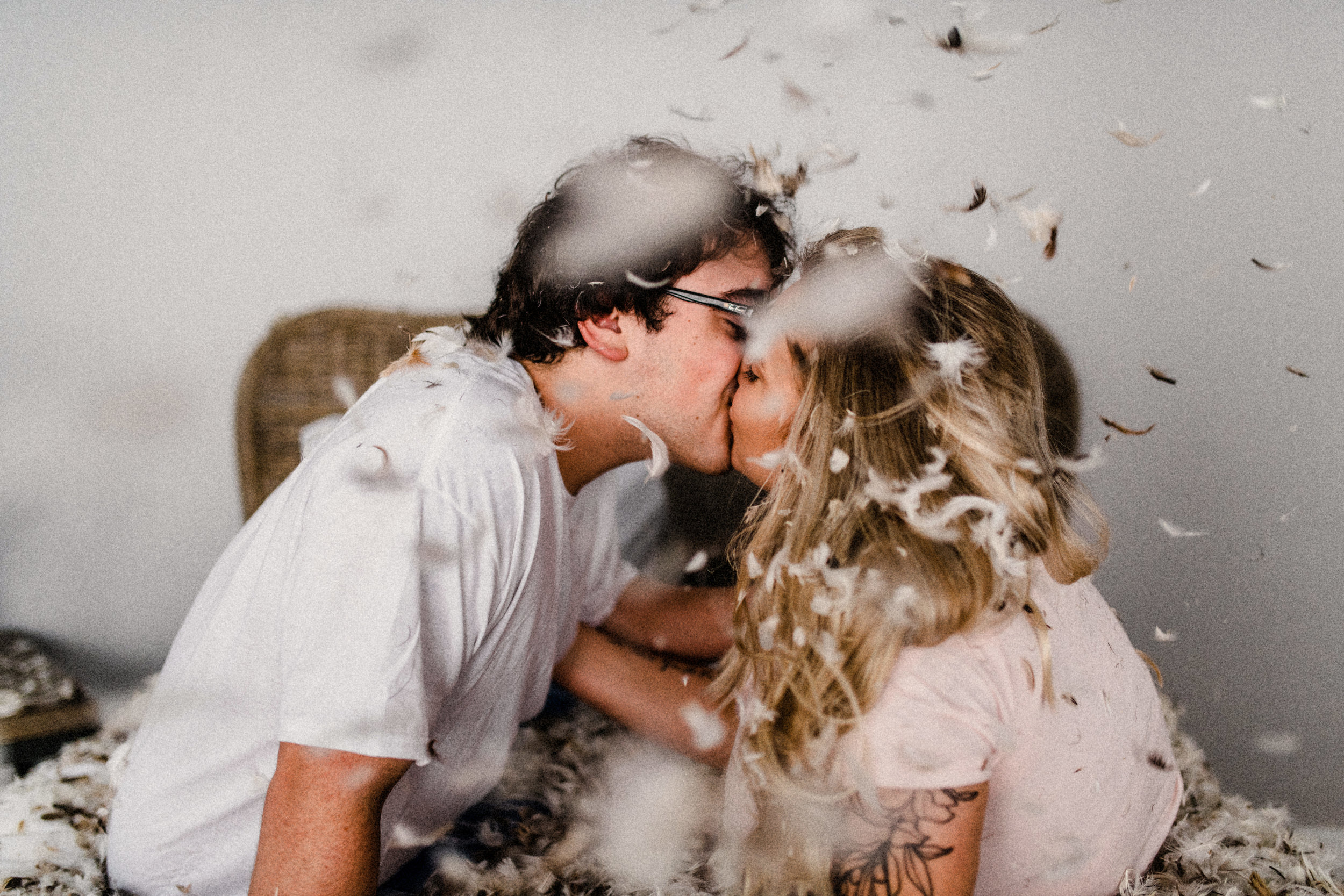  Samantha & Patrick having a pillow fight in their in-home engagement session in Seminole Heights Tampa Florida 