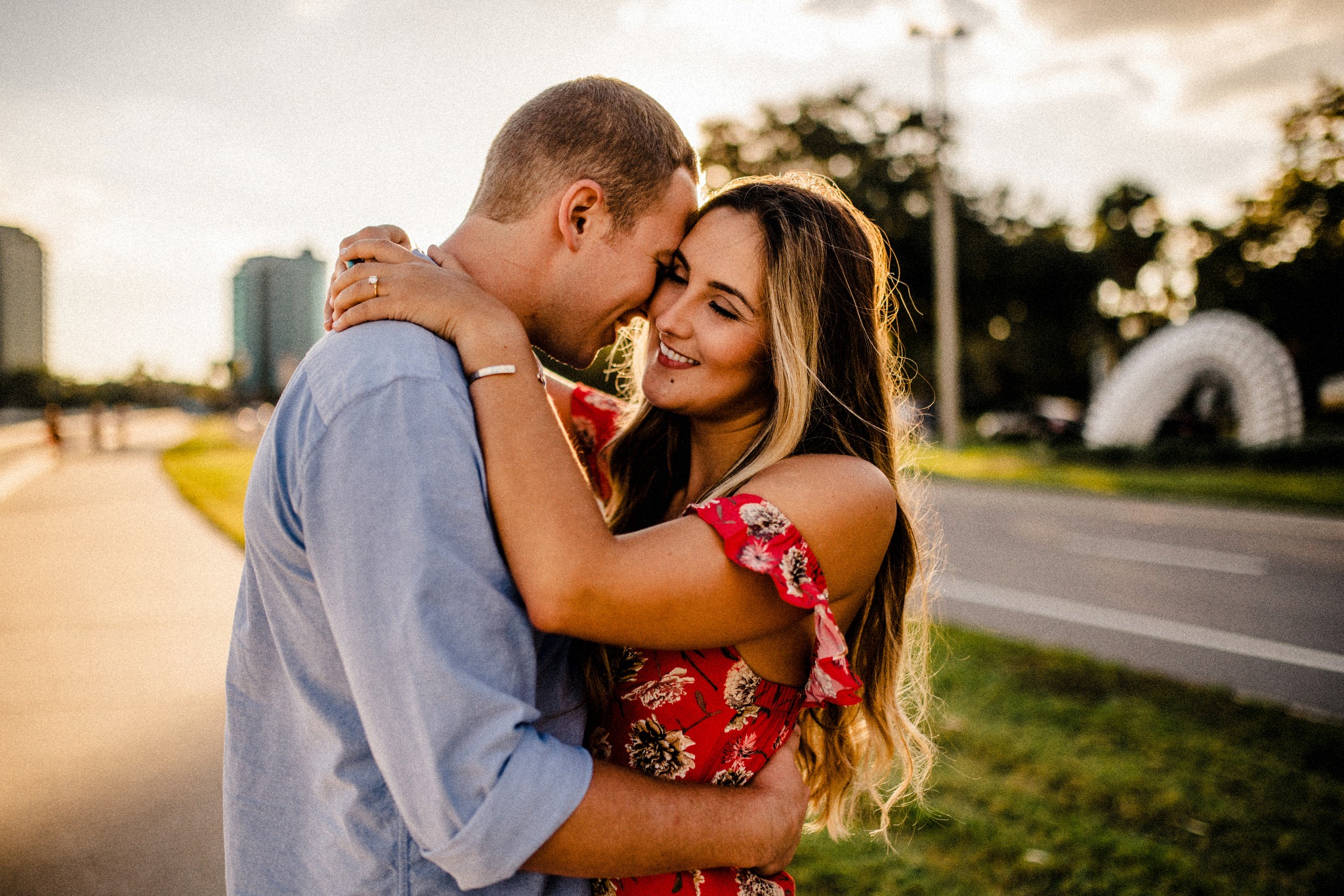  Raleigh & Mary embracing one another on Bayshore Blvd in Tampa Florida during Golden Hour 