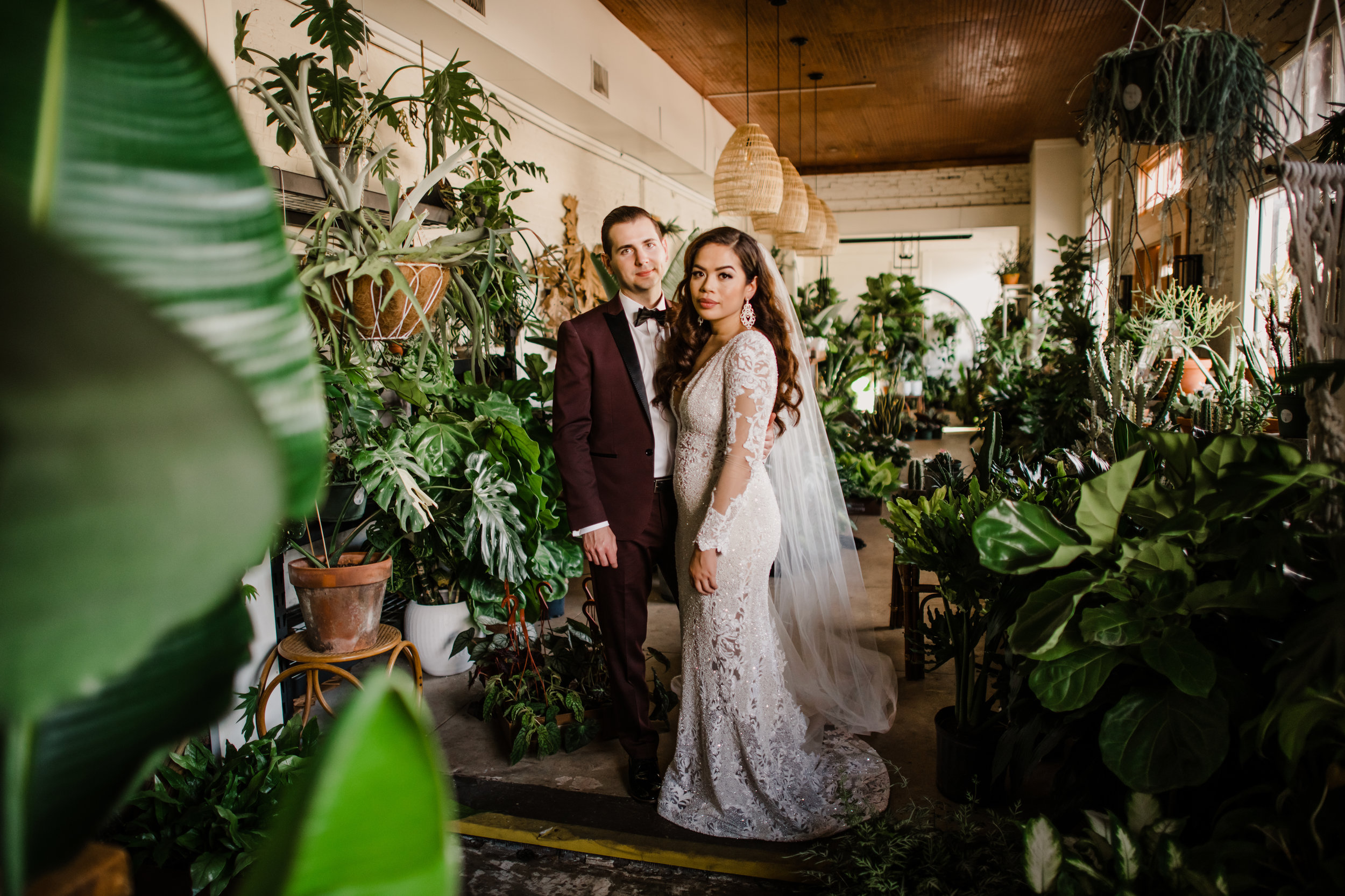  Bride and Groom posing for their bridal portraits at Fancy Free Nursery in Tampa Florida 