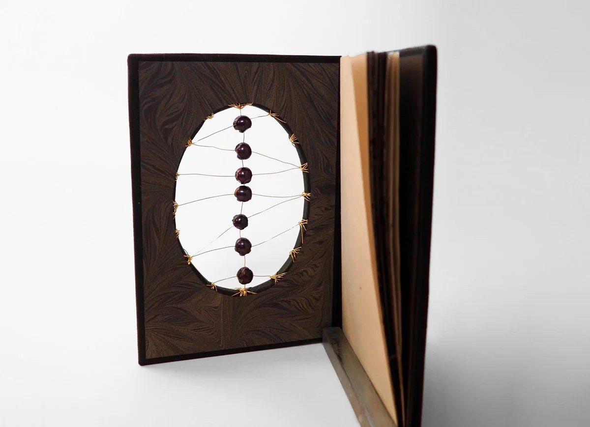 bound-by-cooksey-7-skulls-inside-cover-open.jpg