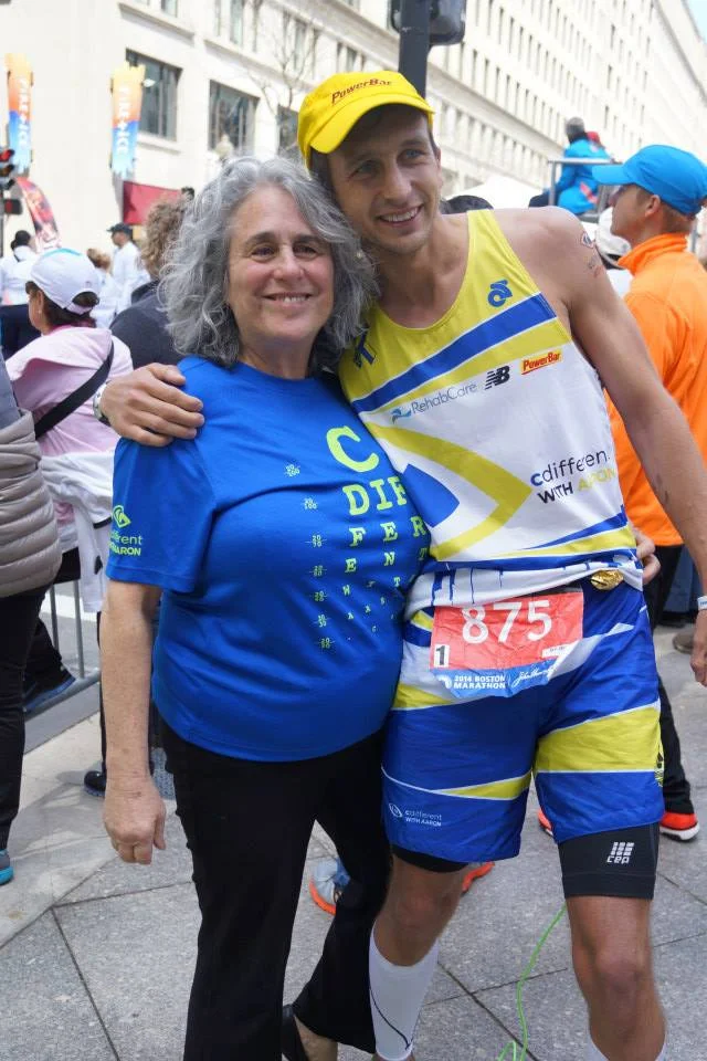 Here's executive director of the M.A.B. Barbara Salsbury modeling the CDWA Boston Strong Eye Chart shirt and myself modeling the Special Edition Champion Systems Boston race kit. 