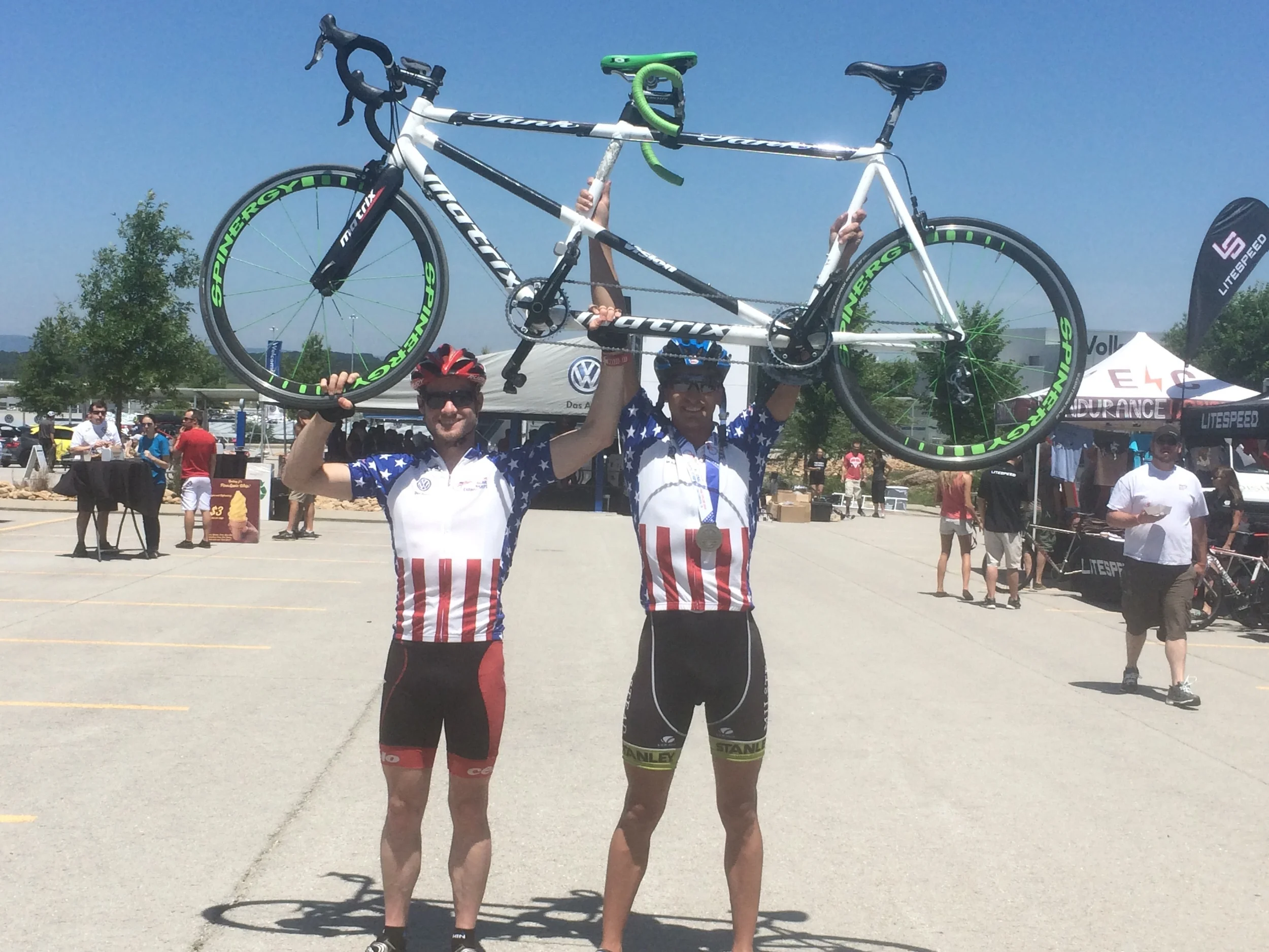 Ben Collins and I hold up the Matrix tandem in victory after US Para-Cycling Nationals.&nbsp;