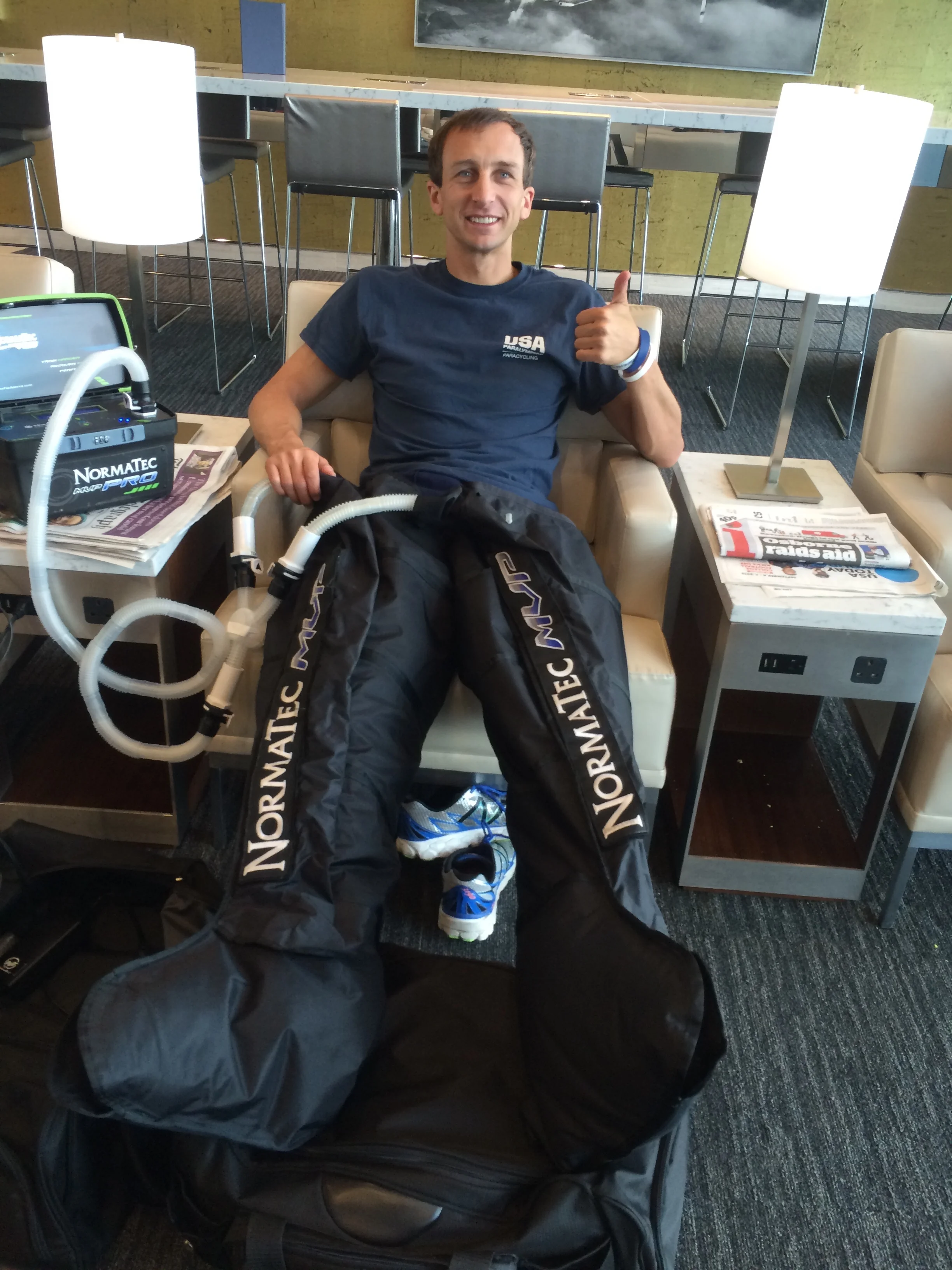 Recovering between races using the NormaTech boots to flush the legs.