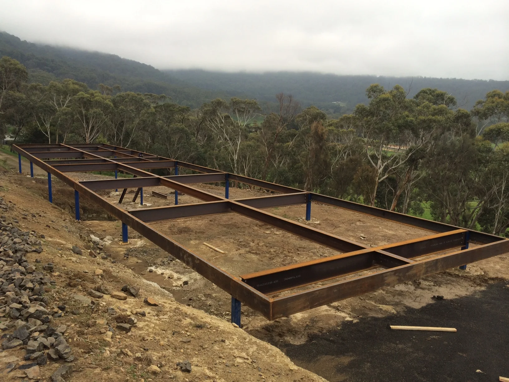 37m long x 7m wide and up to 4m high steel frame cantilevering towards macedon ranges