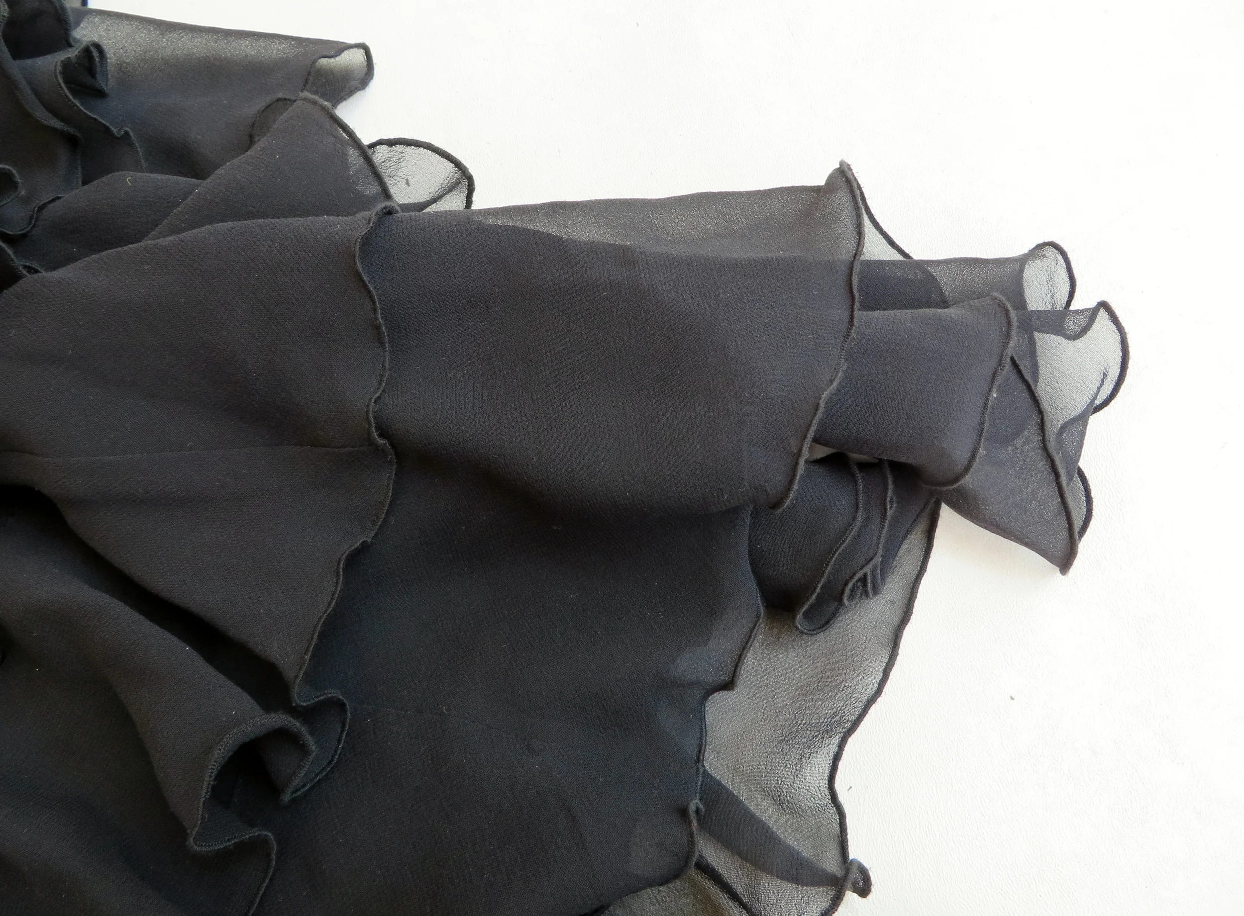 Ruffles of a 1930's reproduction silk chiffon gown - sold