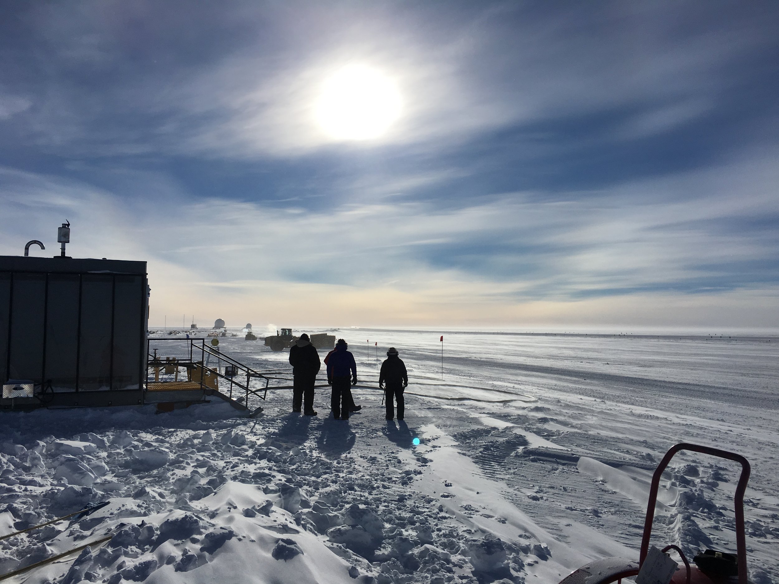South Pole airfield cargo crew, watching a flight take off