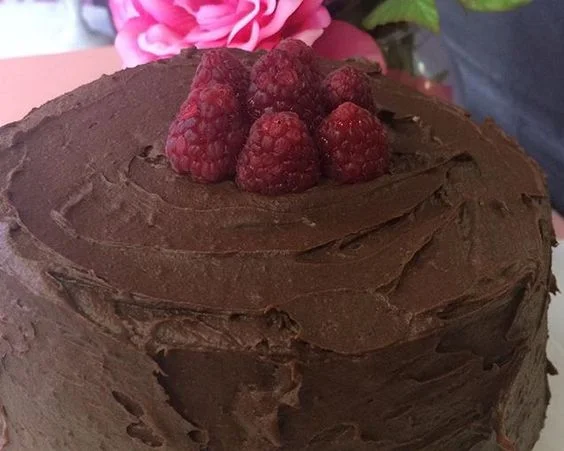 Lady Godiva - 3 layers of White velvet cake filled with raspberry preserves. Frosted with chocolate ganache. 6 inch $40 8 inch $50