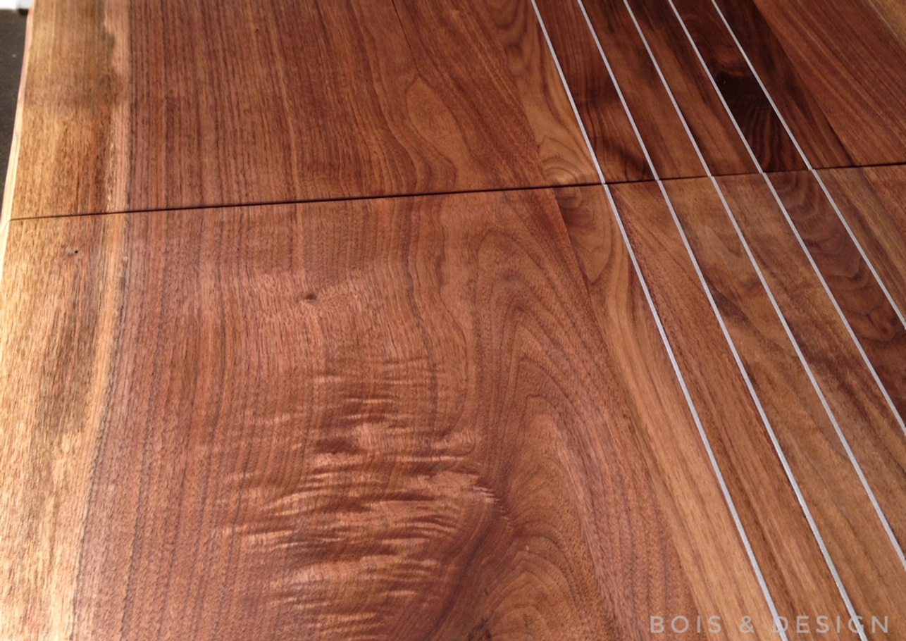 Black walnut dining table with aluminum inserts