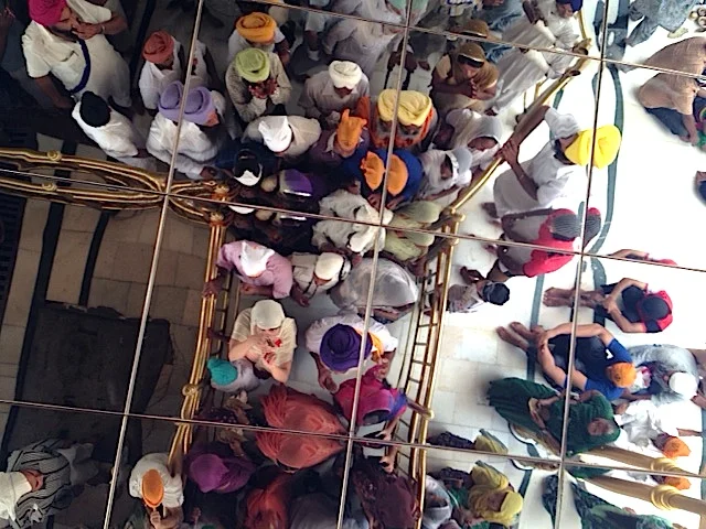 Before I am 'known' at my book event, I head alone into a crowd of unknown people at The Golden Temple in Amritsar. This is a picture of us reflected in the mirror above our heads.