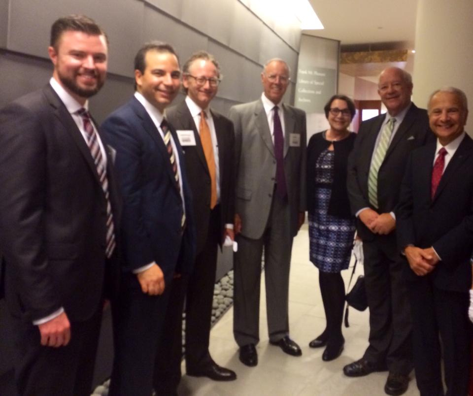From left: Mike Brown '06, Sinan Kanatsiz '97 (MBA '00), Lawrence Armstrong, Parker Kennedy, Lynne Doti, Honorable Finbar Hill, and President Jim Doti