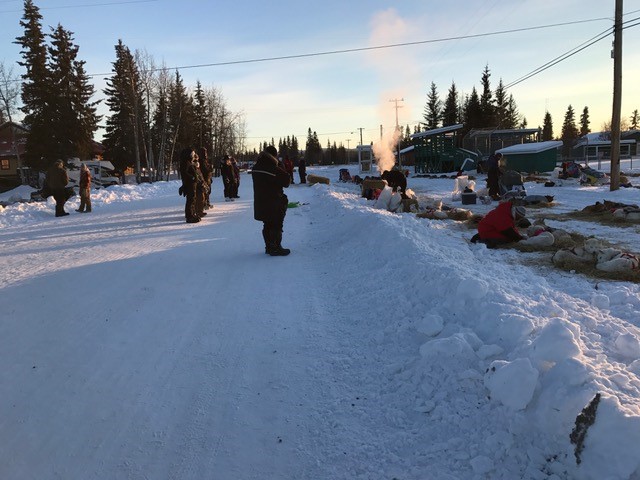 The mushers resupply their bags and fix their sleds.