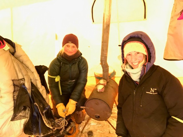 After vet checks, feeding, massaging, and bedding down the pups, Gunhild and Shaynee will settle into the handler's tent close by.