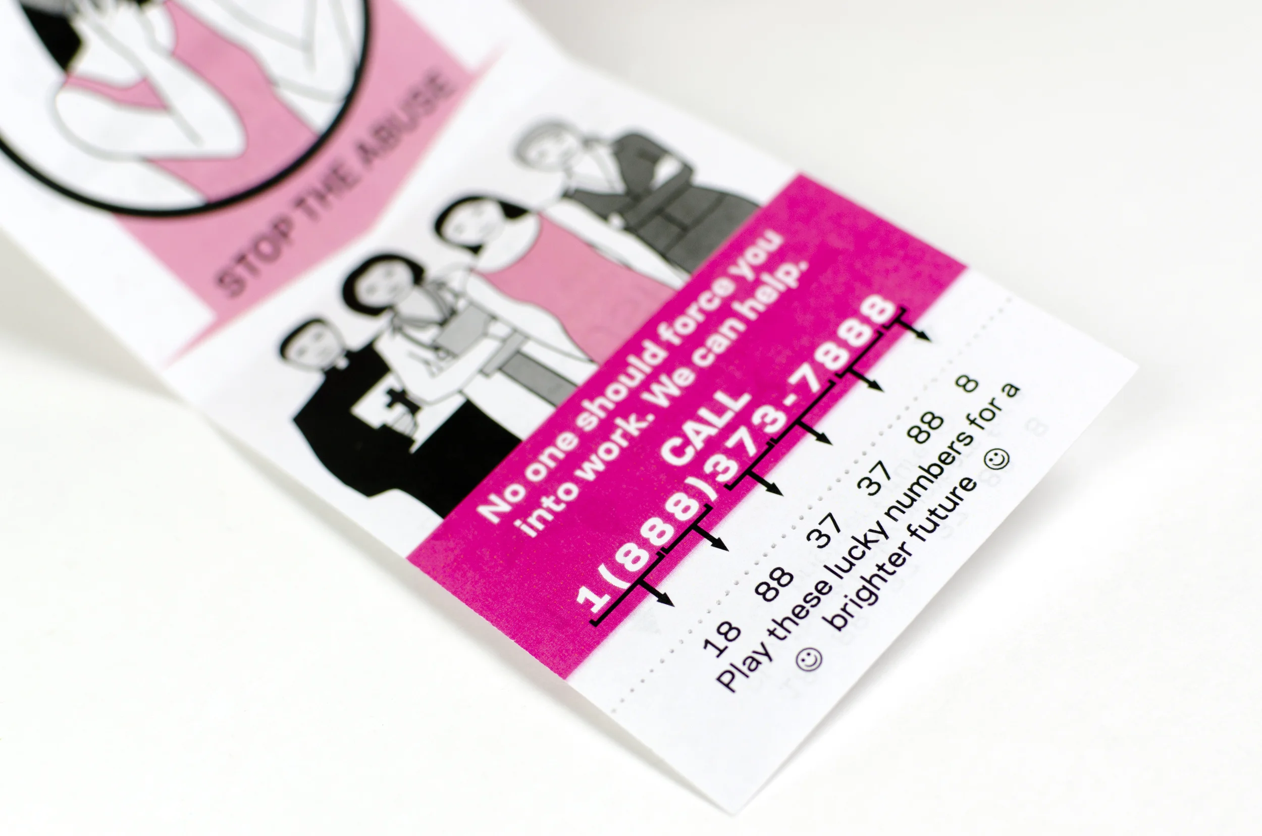 Tear-offs containing the help hotline phone number are disguised as a fortune cookie fortune with lucky numbers.