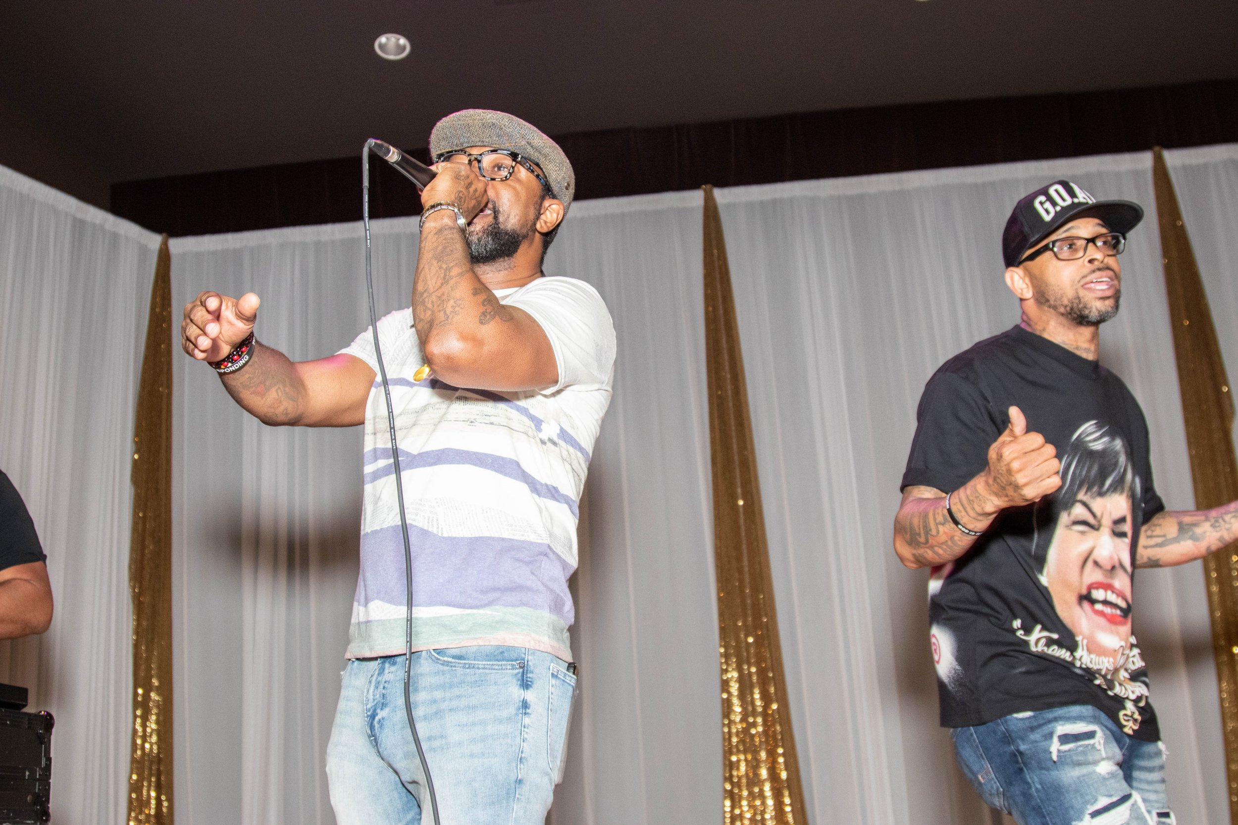 The renowned rap duo Partners N Crime (PNC) performs at the Sneaker Ball, energizing the crowd of McD 35 alumni.