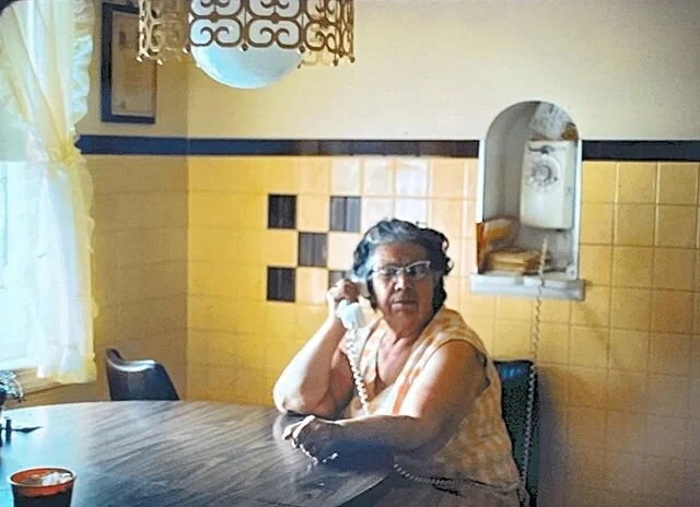 This is my great grandmother, &ldquo;Grama Poet,&rdquo; in 1978. I found this old photo over the weekend. How did she look the same until 1992? Is that light fixture tucked away somewhere still? The yellow tile has been re-glazed, but the phone might