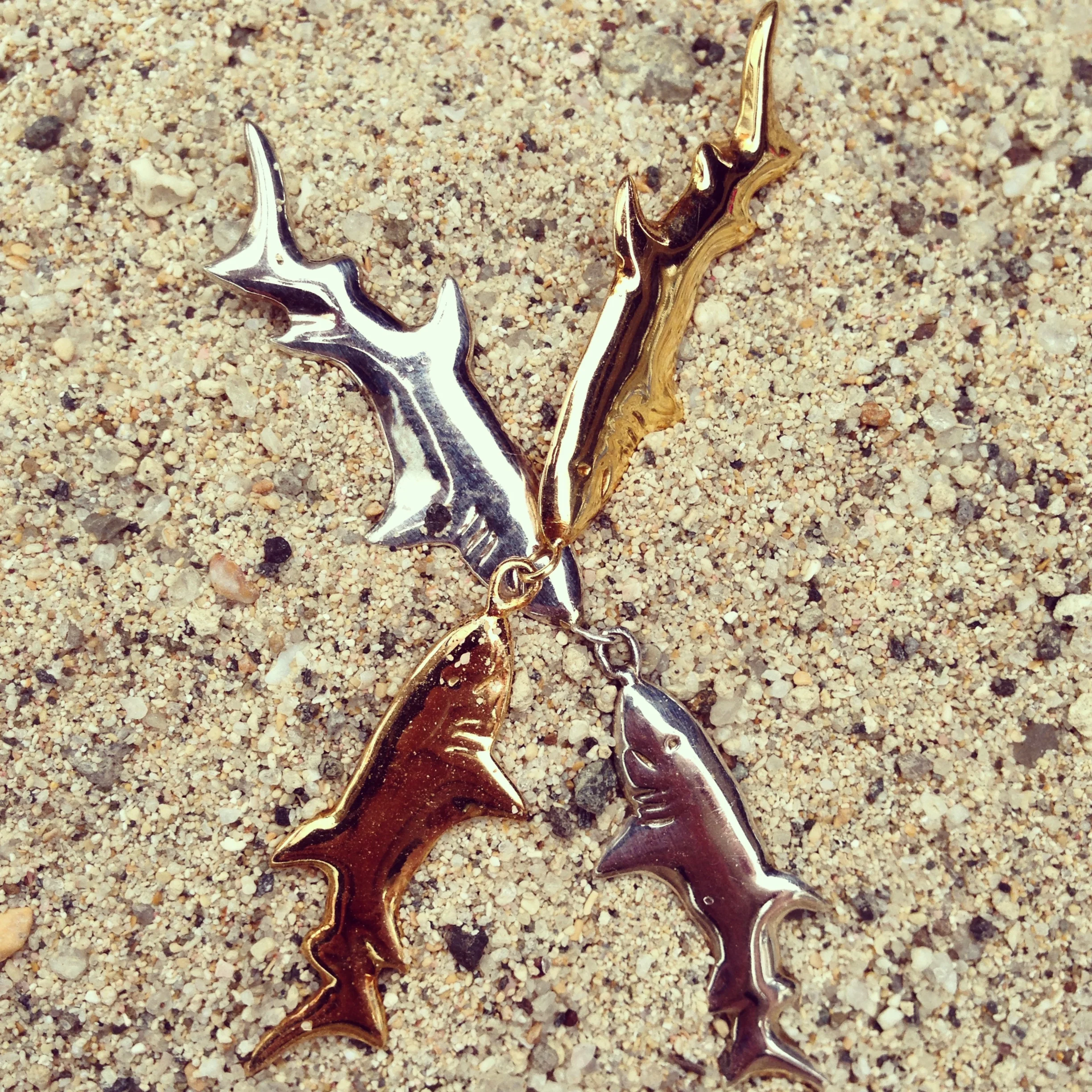 Shark Earrings in Sand.JPG