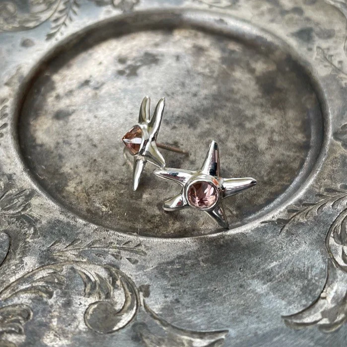 Sterling silver and zircon starfish - zircon is a natural and pretty awesome stone that suffers from a superficial name similarity to cubic zirconia which is synthetic c@$p in my humble opinion. BUT, zircon is an awesome stone with a high refractive 