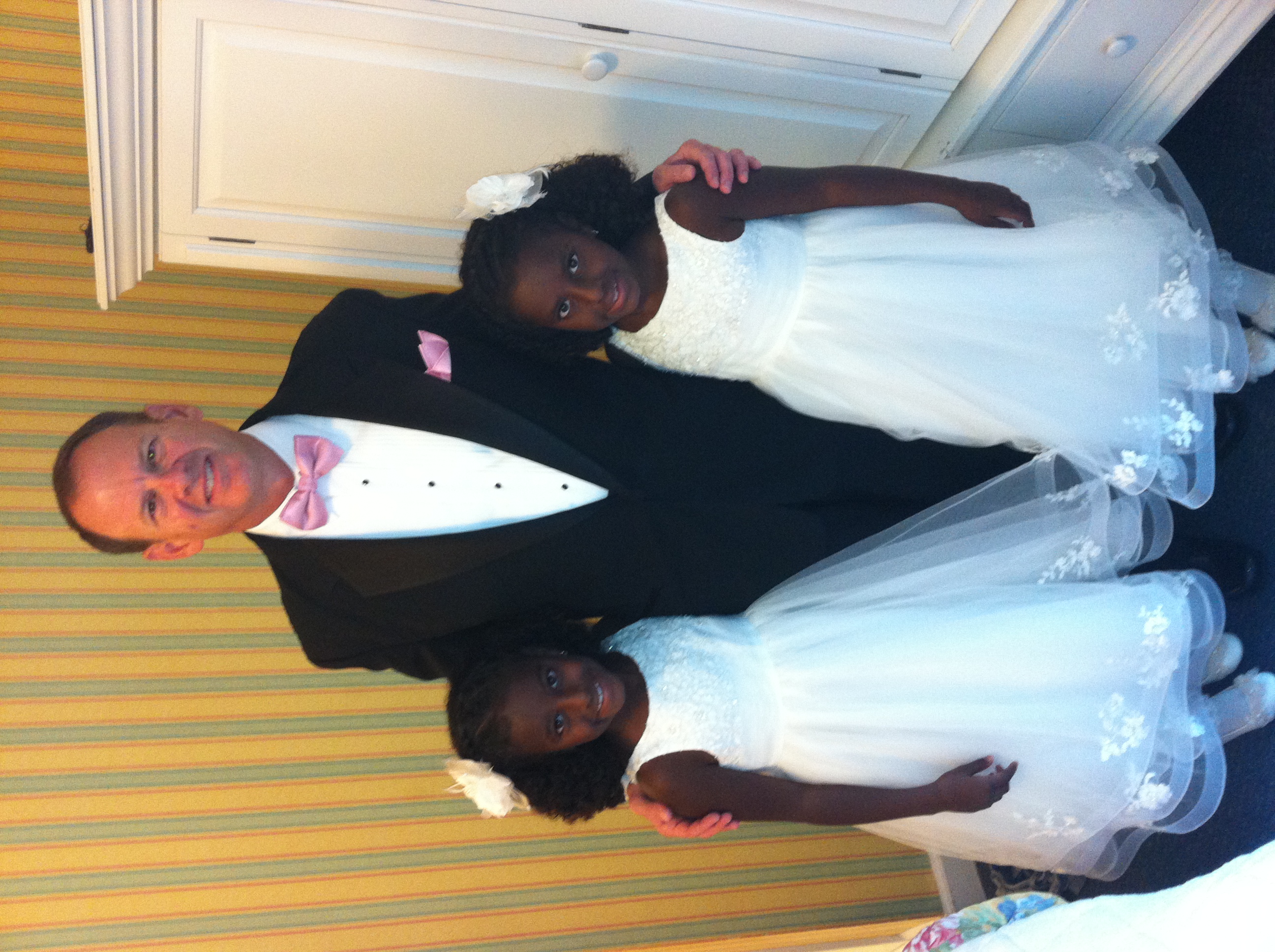 Twins Candace (L) and Sarah (R) in the summer of 2013 when they were flower girls.