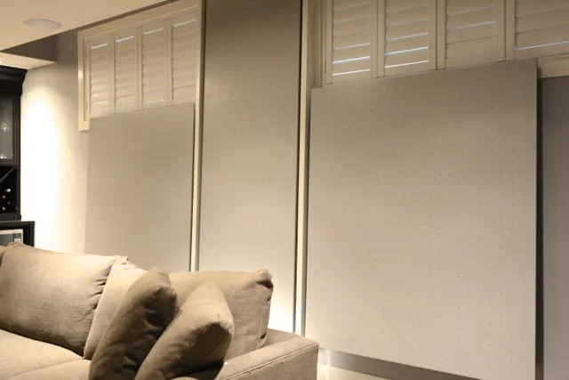 Home theatre room - custom made sound absorbing back wall panels.