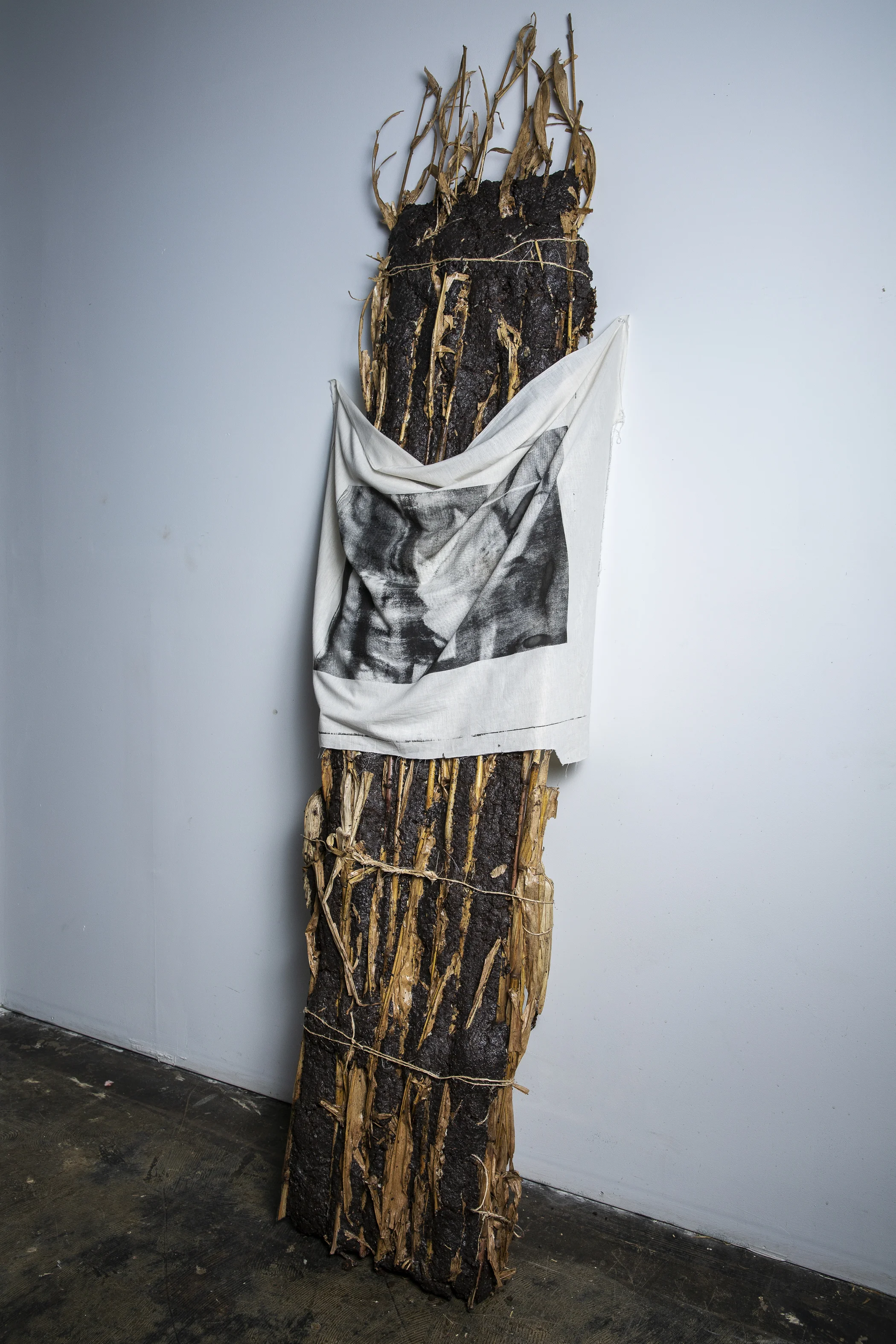 "Harvest, Transcendence" 2019. Cast corn and soil, twine, hand screen-printed ink on textile.