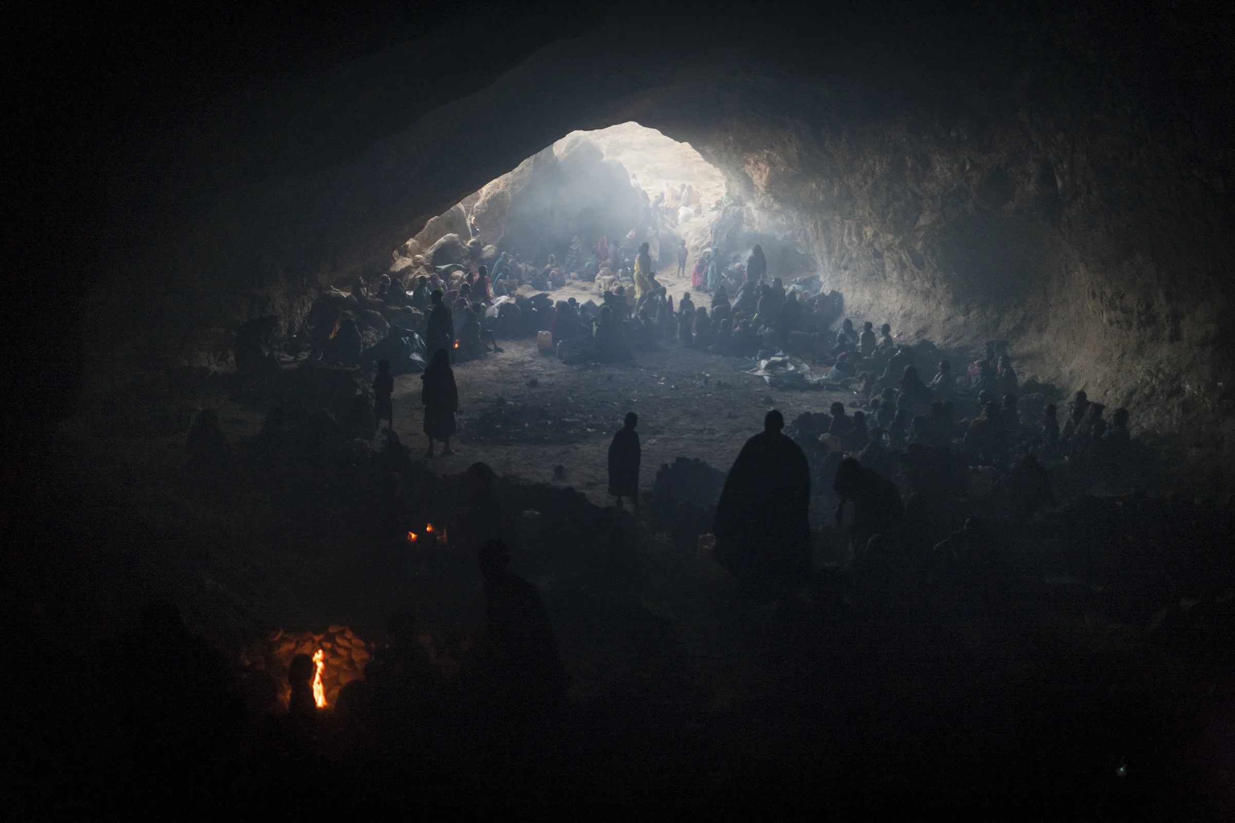 Hundreds of women and children seek shelter in a cave from the bombing by the Sudanese government's forces in Central Darfur, Sudan, March 2, 2015.