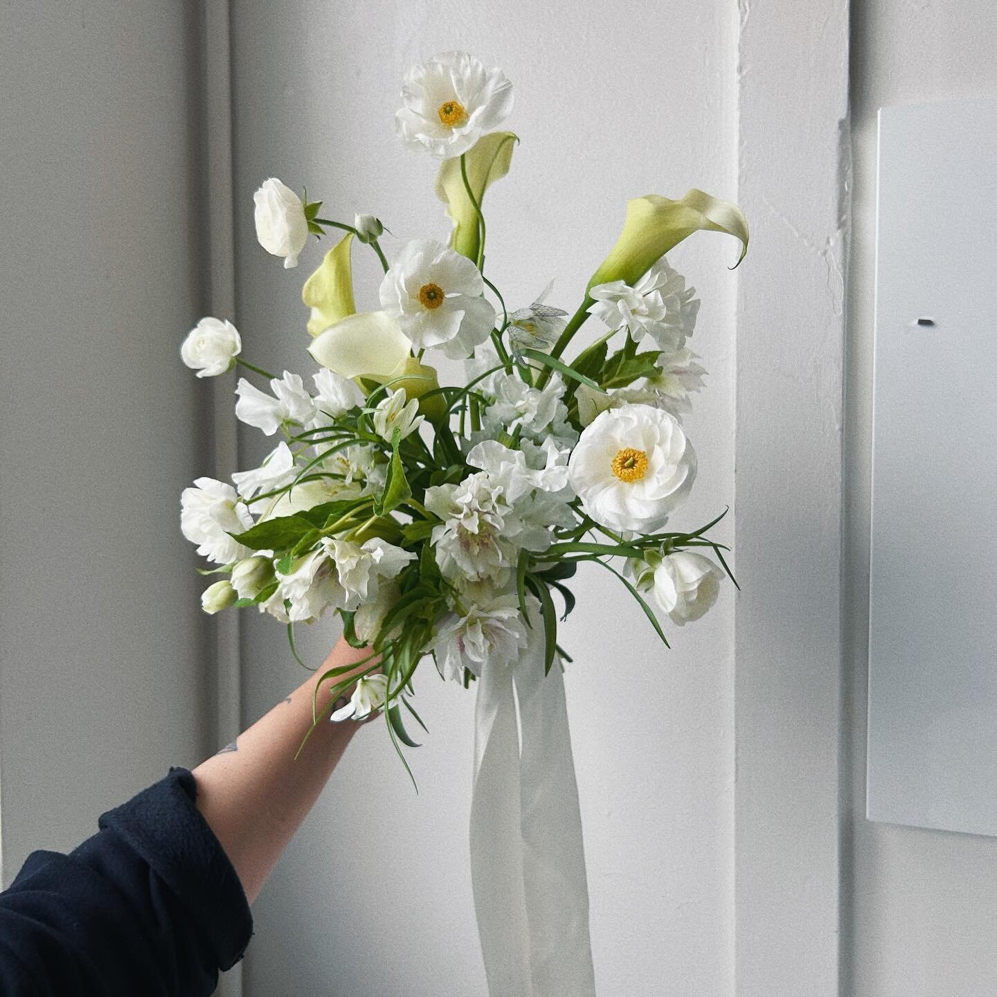 An all white bouquet done the anti bride way - with bounce + texture, full of checkered lillies, locally grown ranunculus and hellebore