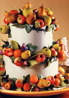 Some cakes have fruit and leaves instead of flowers.