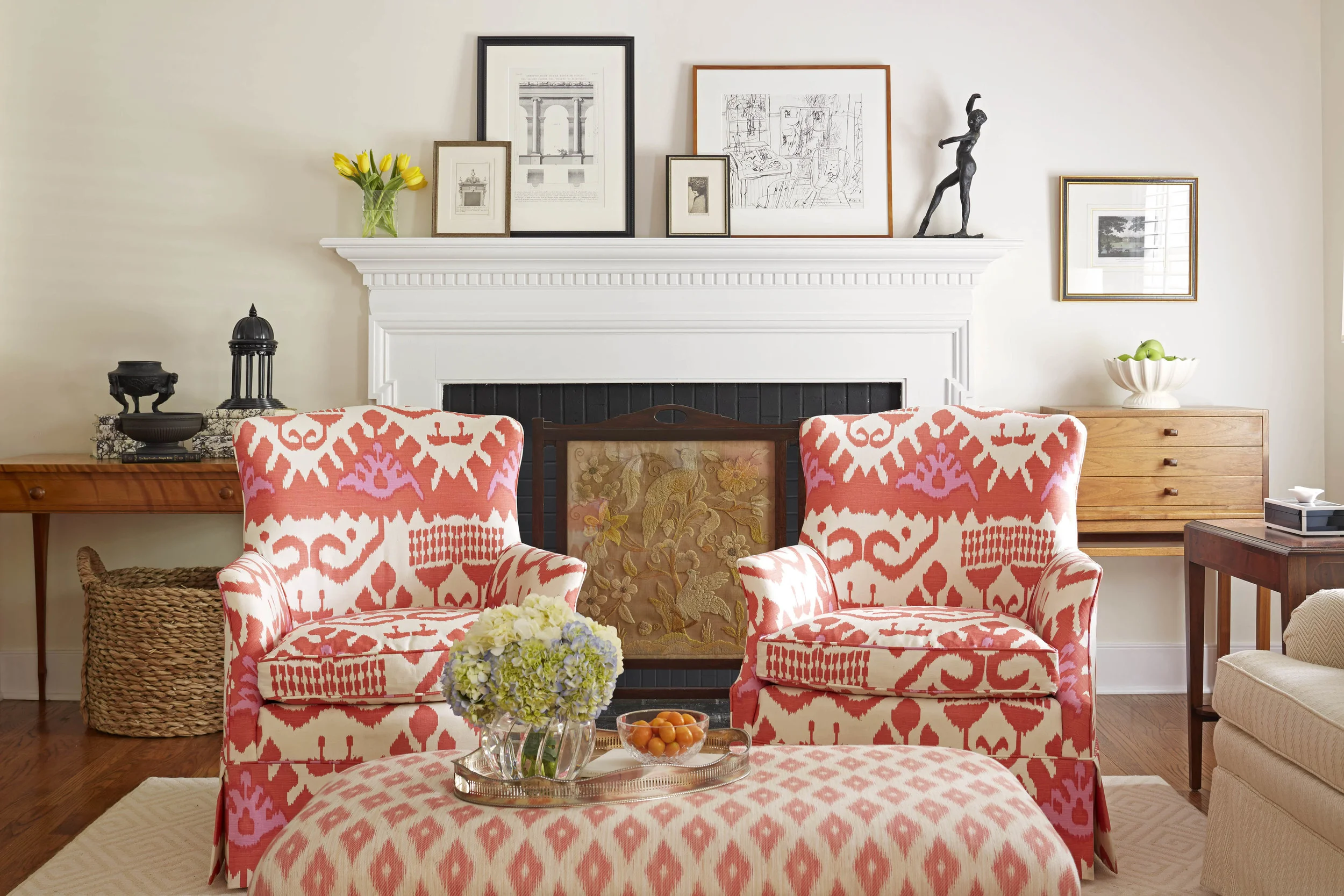 Quadrille made the exuberant Ikat on the pair of chairs. The fireplace screen is one I found in England several years ago. The collections are asymmetrically arranged and include Wedgewood "Basalt" which works equally well in traditional and modern interiors.