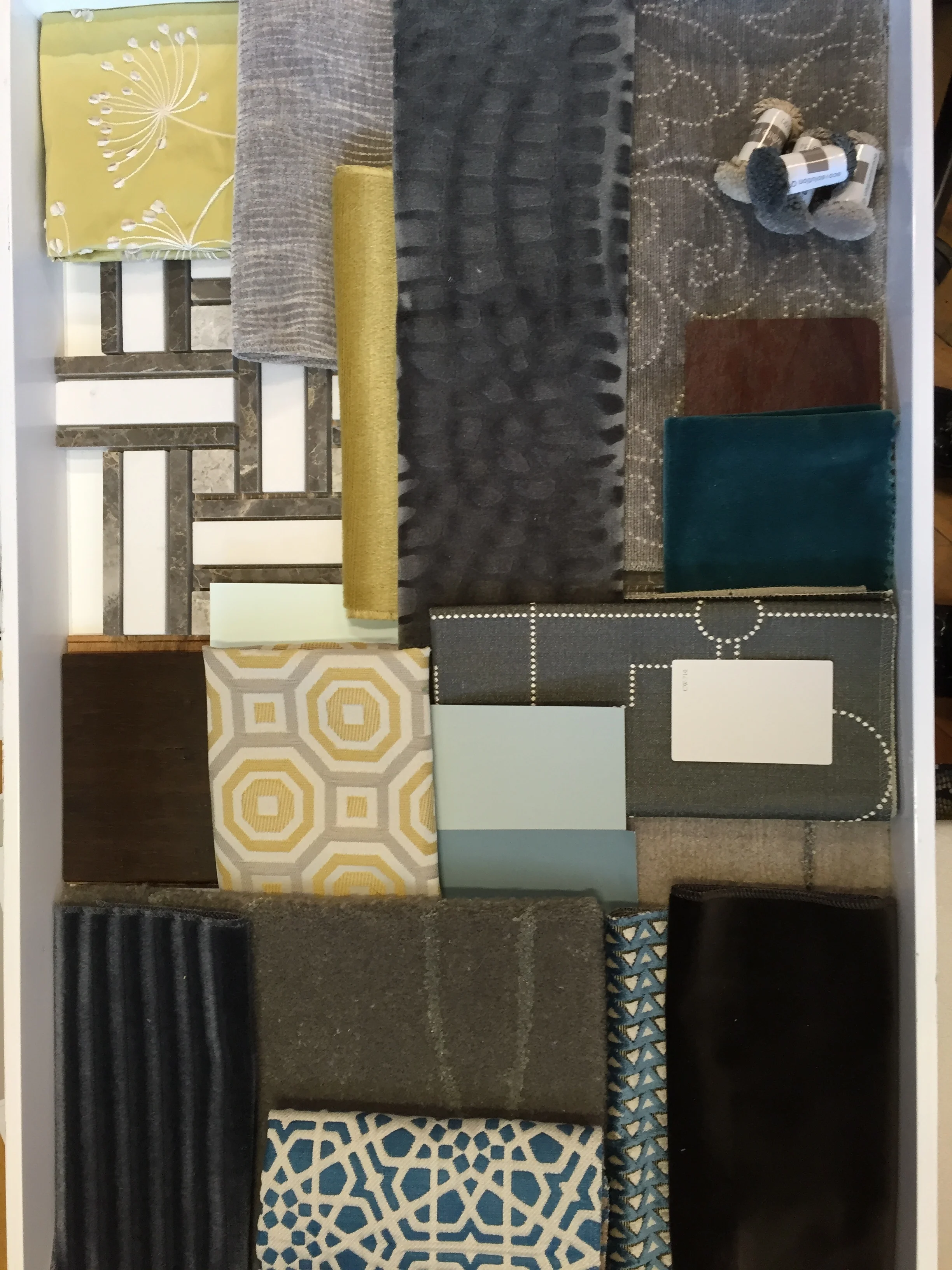 A palette of greys, peacock, and citron for a historic art deco hotel.