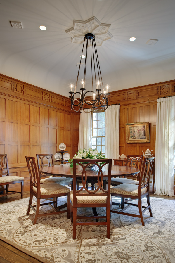 This dining room became the cypress room for clients who also owned a house in the low country of south Carolina. the fret work design is from a 16th century English house. The rug is by Stark Carpets, the chandelier is by Ironwork International. Colfax & Fowler is at the windows and completes the look. 