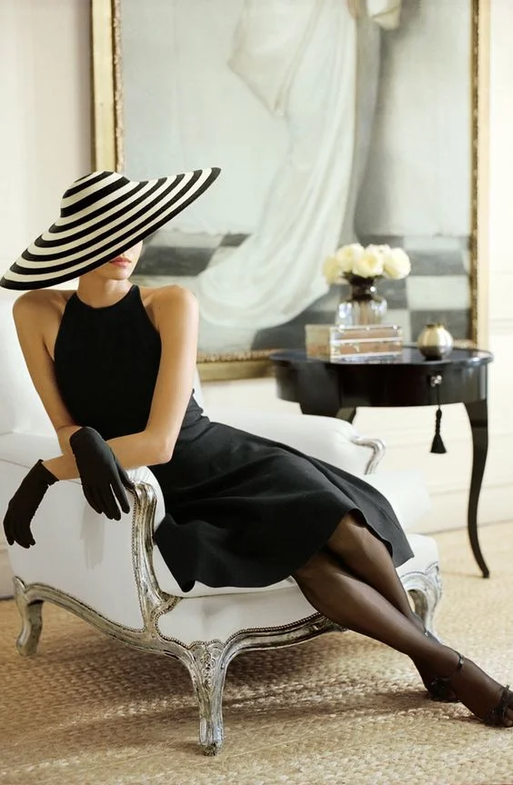 Ralph Lauren always conjures a story, a sense of drama that adds to the richness of life. Here a black and white stripe hat that captures and holds the eye.