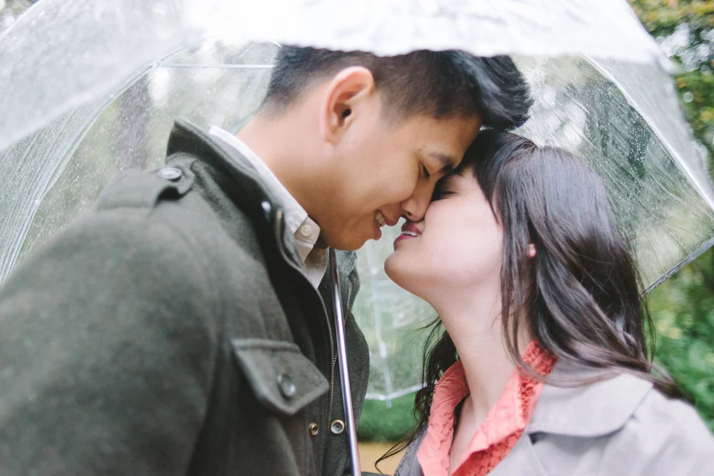 Leach-Botanical-Gardens-Engagement-Photography-umbrella-rain-kissing-Johan-Dani_0297.jpg