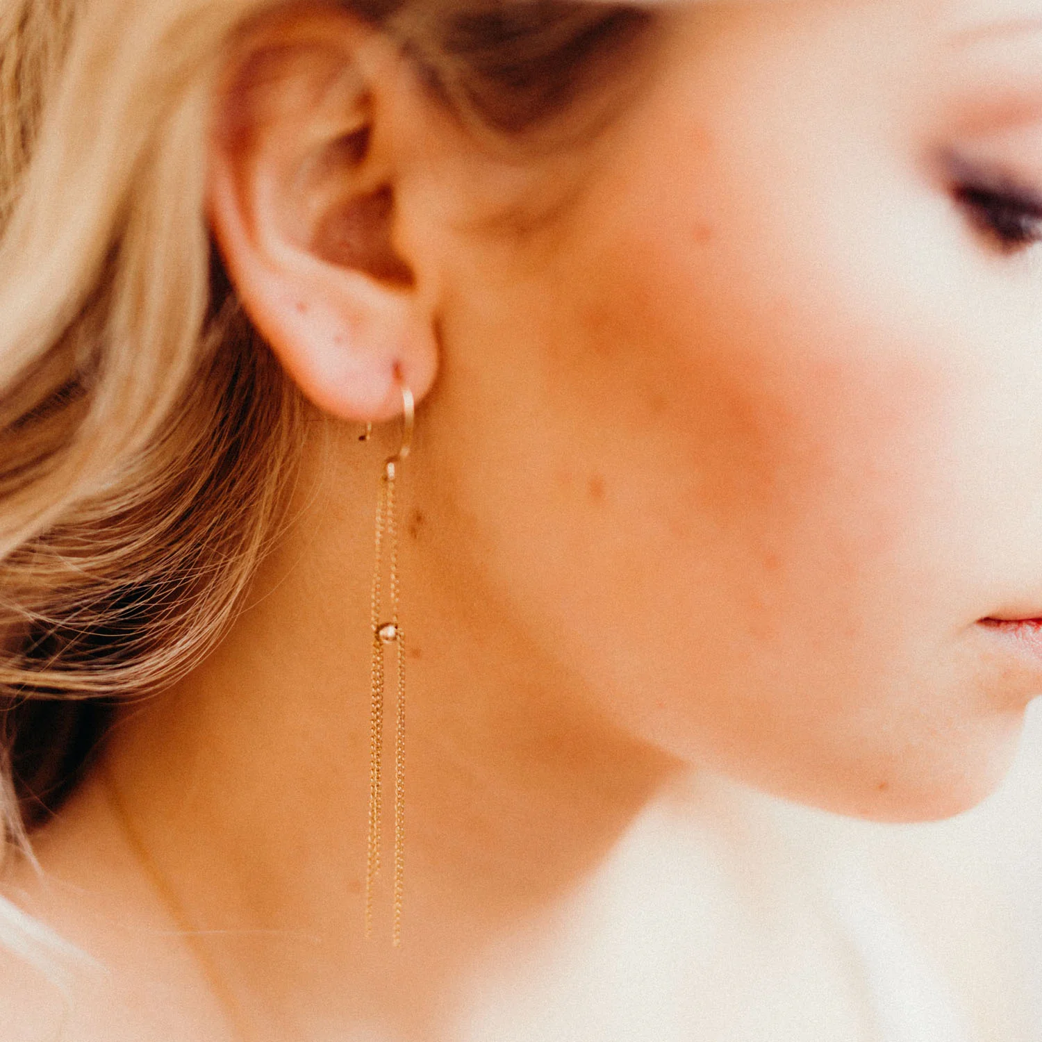 Delicate tassels of chain form lightweight, fluid earrings. Ultra minimal and modern, these are perfect for dressing up or down.